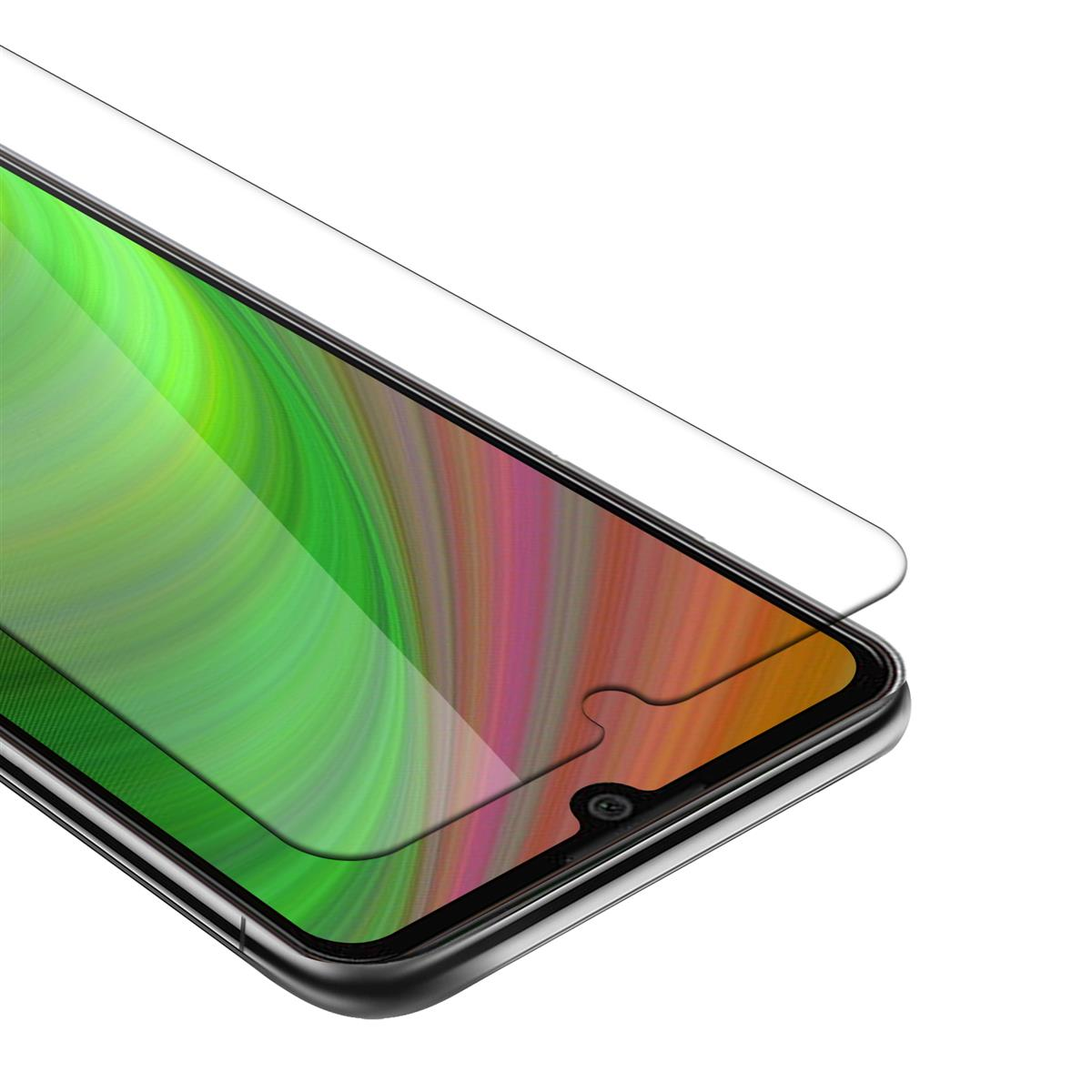 Uno schermo del telefono con una protezione per lo schermo. Lo schermo del telefono mostra un motivo colorato. La protezione è trasparente.