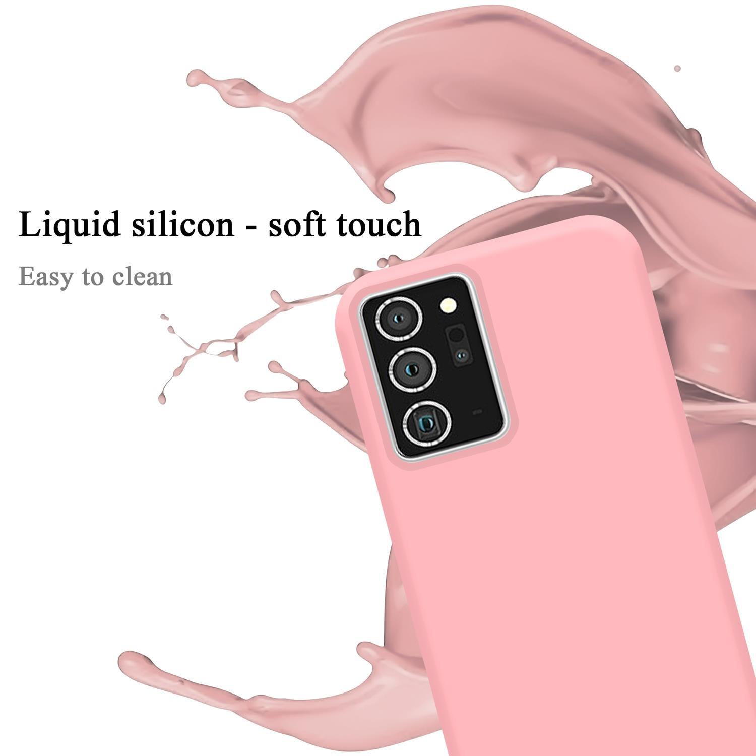 Custodia rosa per telefono con un tocco morbido. Uno spruzzo di liquido rosa sullo sfondo.