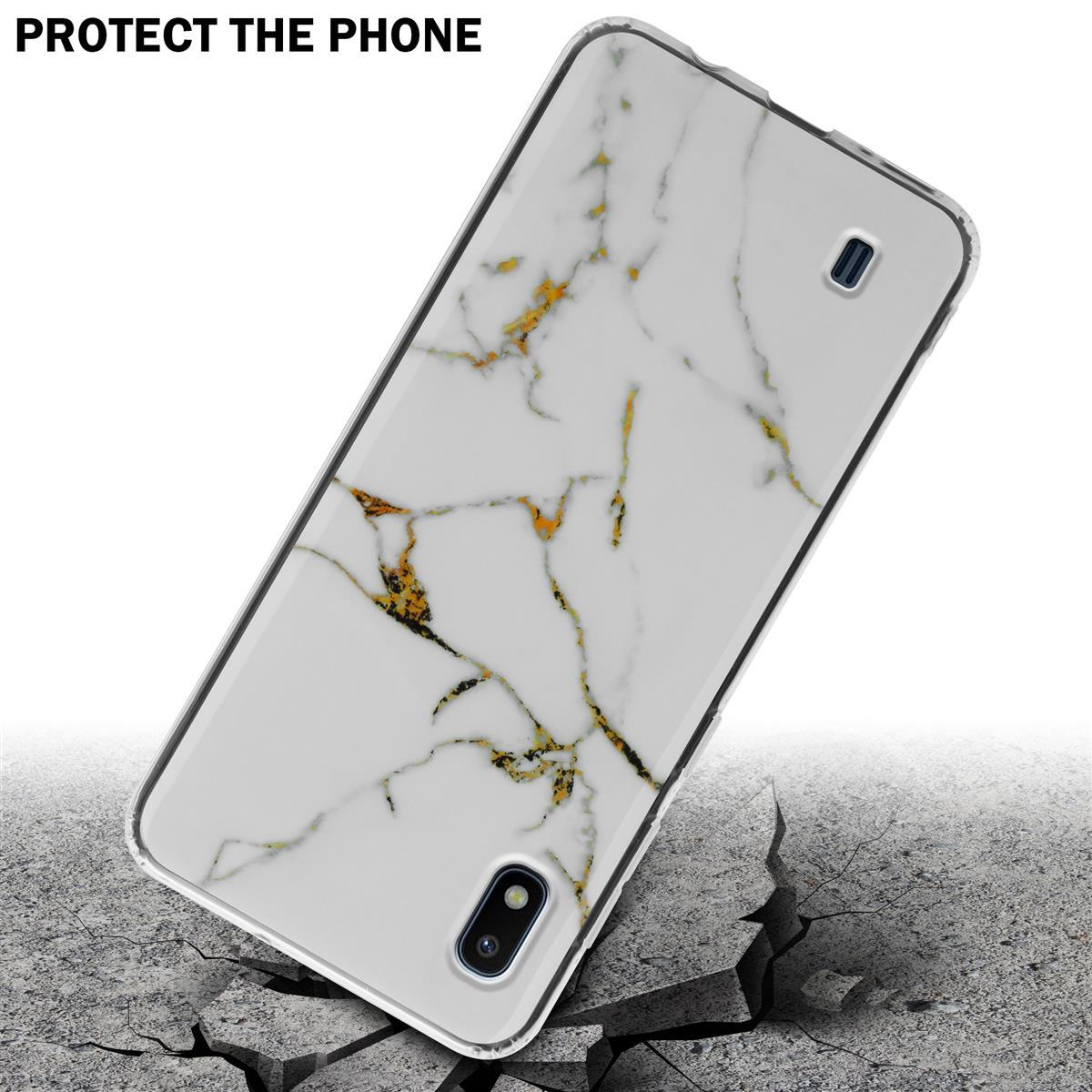 Una custodia per telefono, bianca con design in marmo dorato. Il testo dice 'Proteggi il telefono'. Terreno crepato.