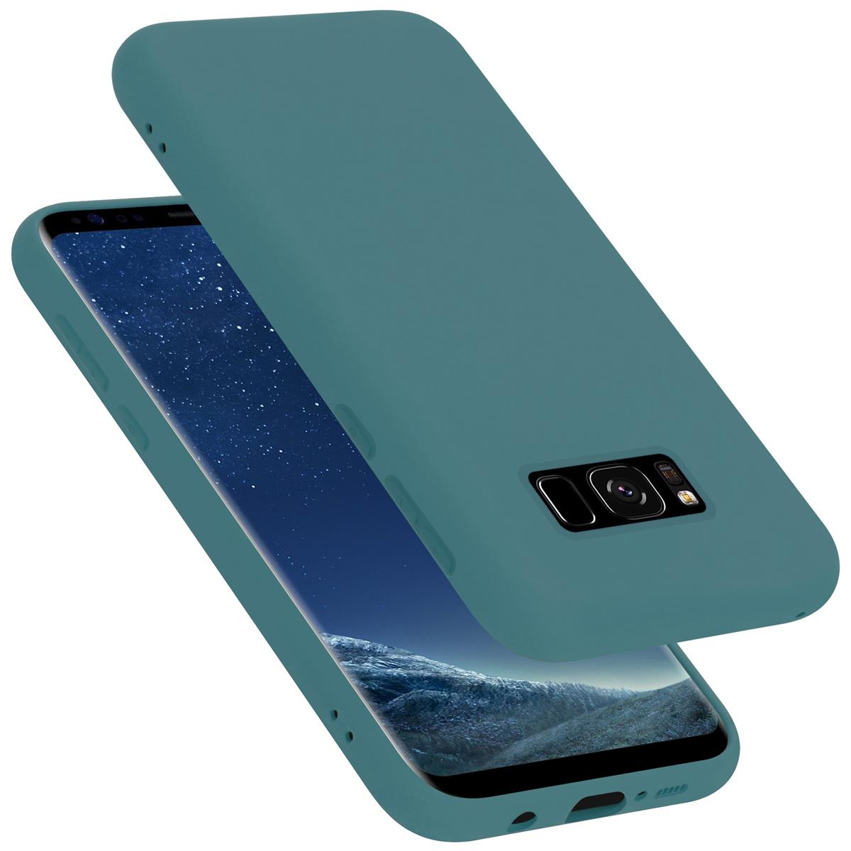 Türkisfarbene Handyhülle mit Telefon darin. Die Hülle befindet sich auf weißem Hintergrund.