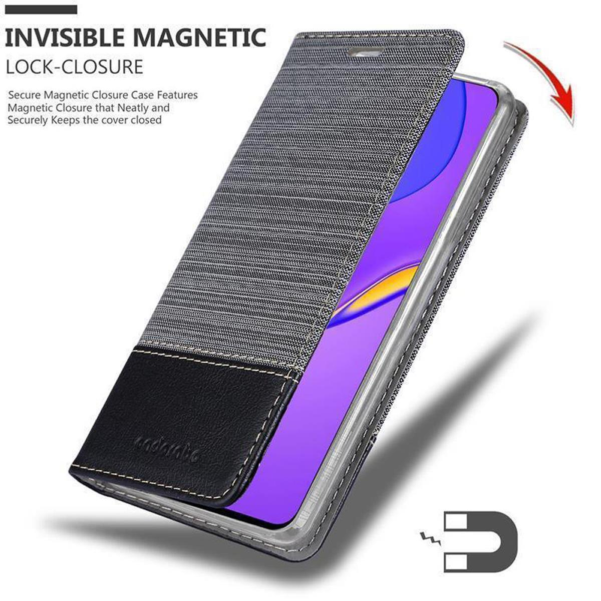 Telefonhülle, grauer Textilbezug und schwarzer Boden. Telefon innen. Magnetverschluss sichtbar.