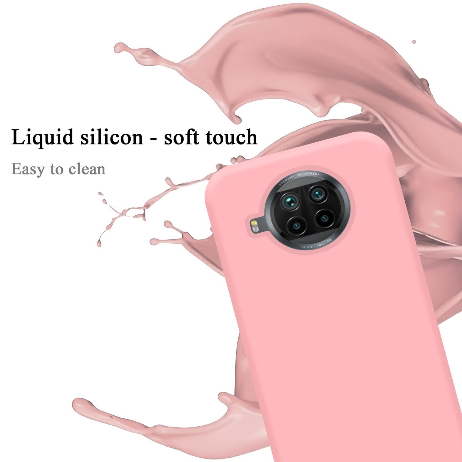Eine pinke Handyhülle mit Kameraobjektiv. Das Bild zeigt auch Flüssigkeitsspritzer und den Text 'Liquid silicon'.
