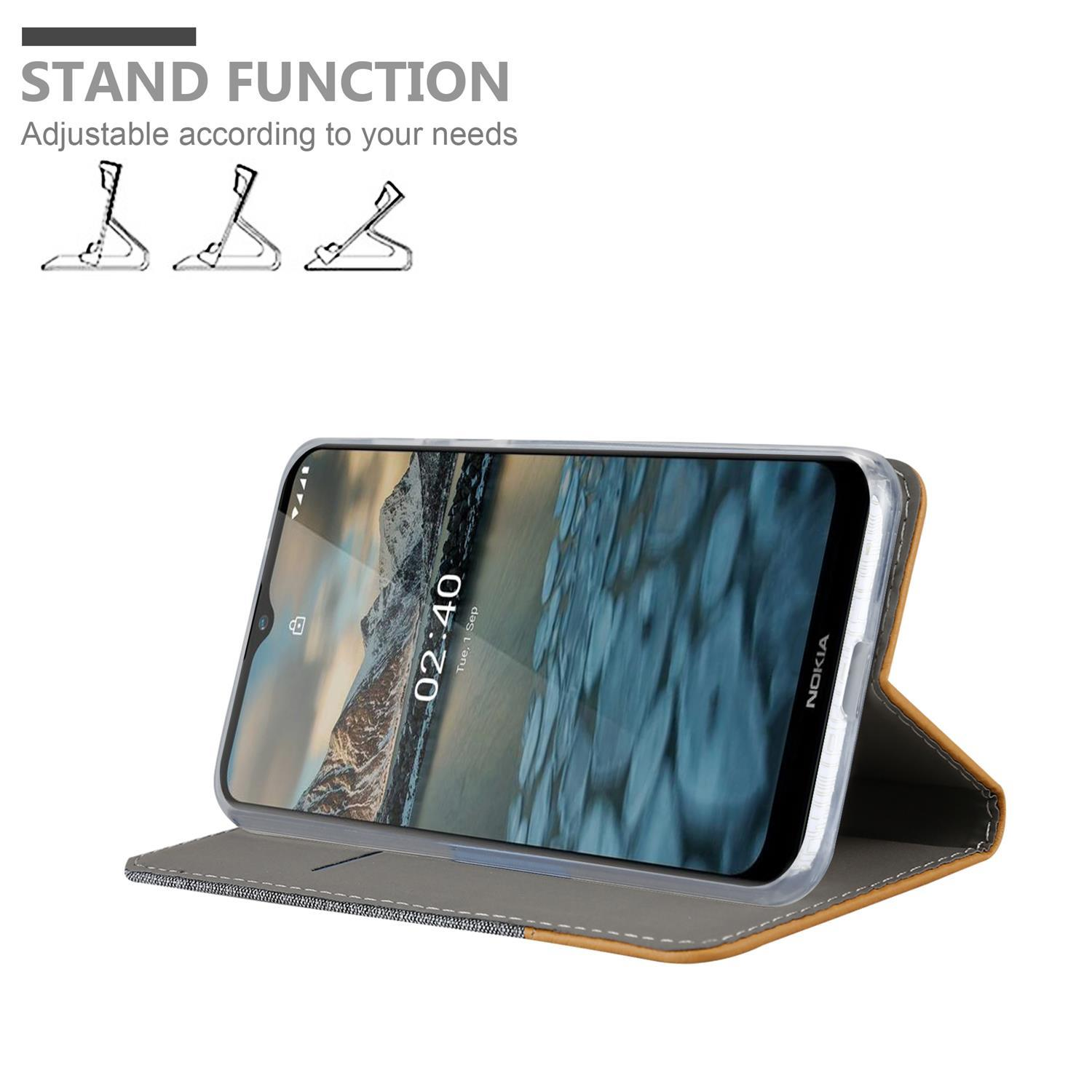 Ein Telefon in einer Hülle, aufgestellt, mit Text, der lautet: Standfunktion, an Ihre Bedürfnisse anpassbar.