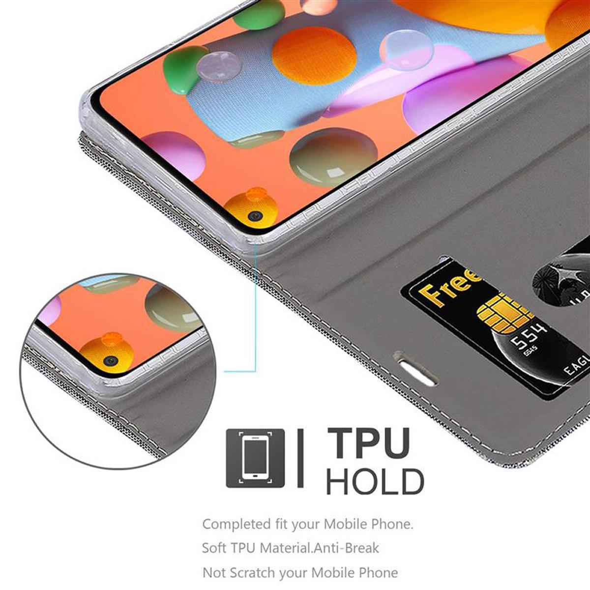 Custodia grigia con telefono e carta. La custodia ha il testo TPU HOLD e il telefono è visibile.