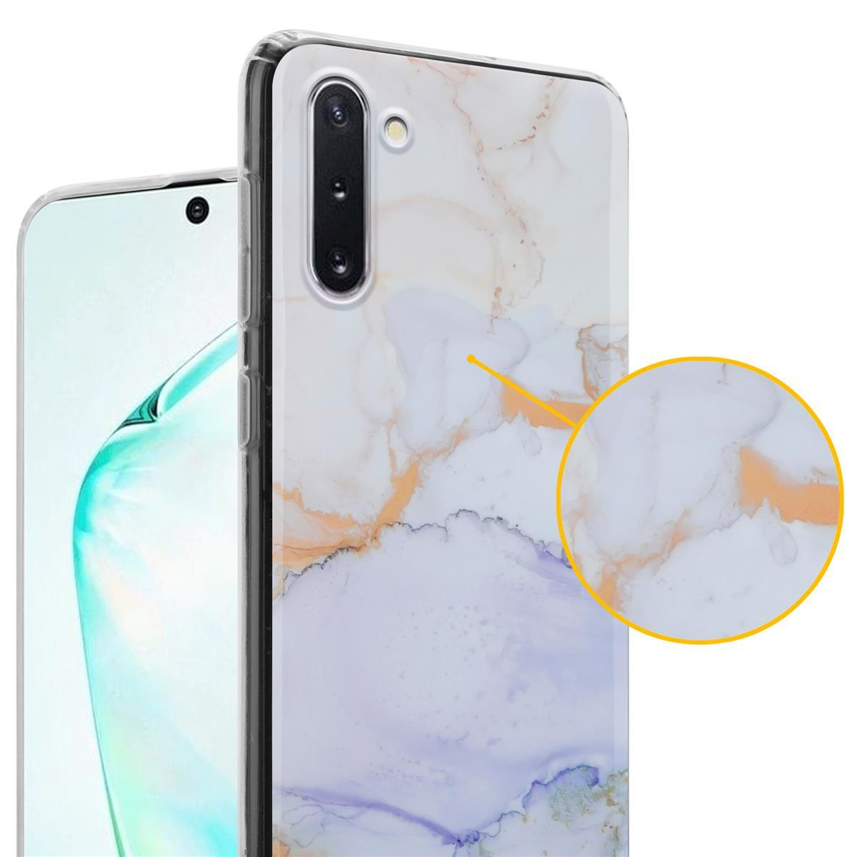 Una custodia per telefono con un design marmorizzato, un telefono e una piccola lente d'ingrandimento circolare.