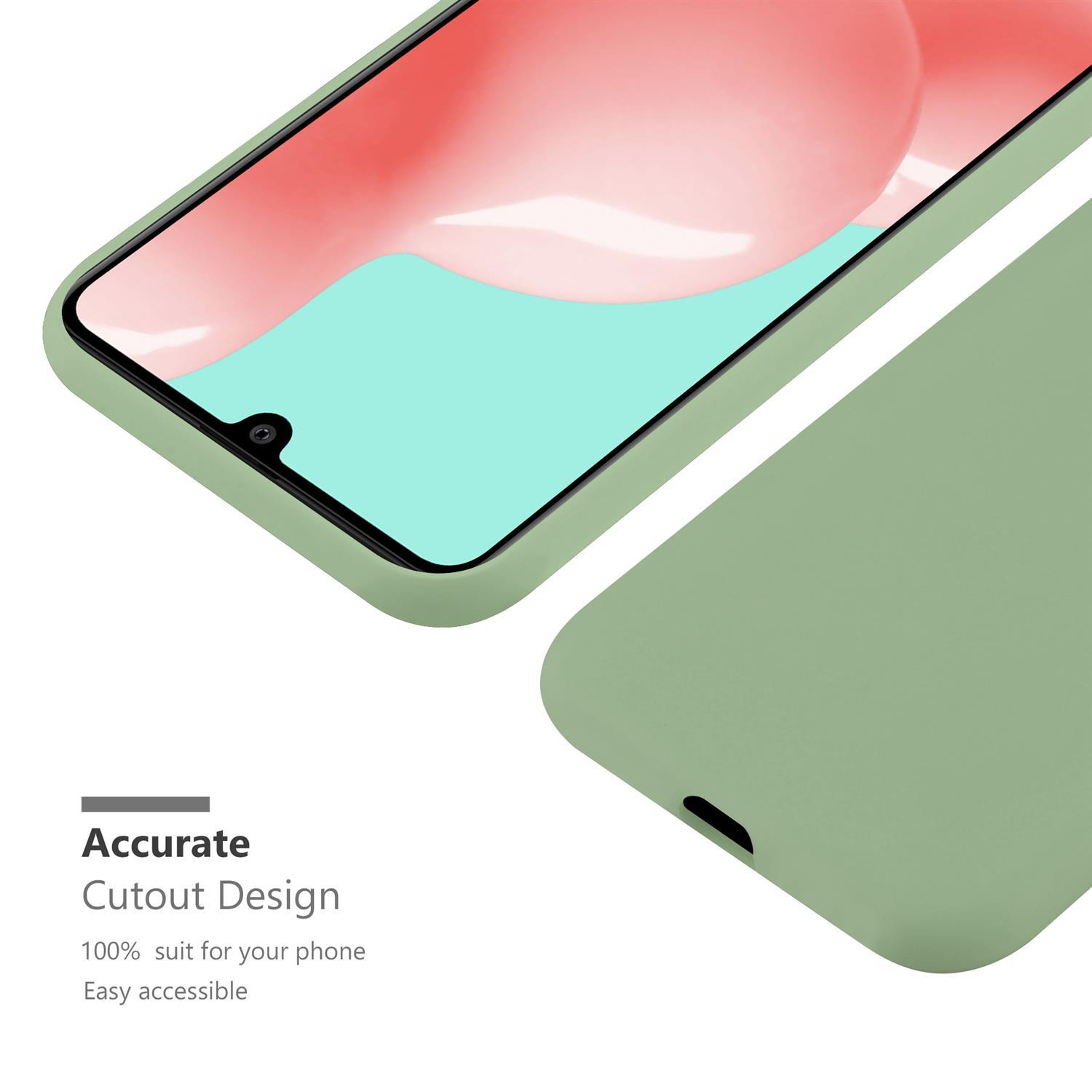 Minzfarbene Handyhülle mit Telefon darin, Ausschnitt für einfachen Zugriff.