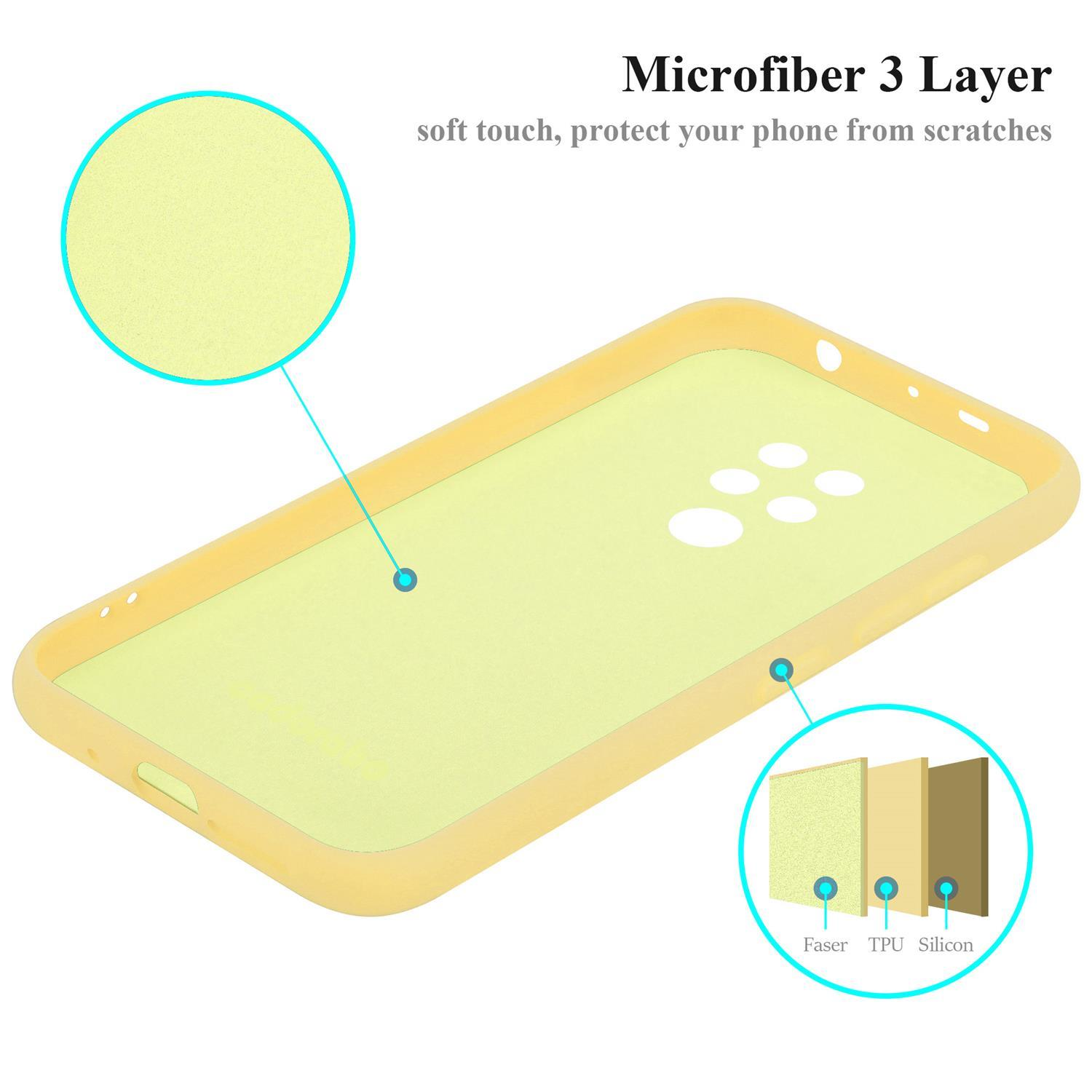 Gelbe Handyhüllen-Innenseite. Materialschichten beschriftet mit: Faser, TPU und Silikon. Nahaufnahme Kreisdetail.
