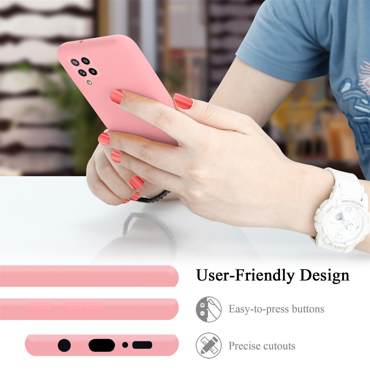 Hand hält ein rosa Telefon mit rosa Hülle. Text hebt benutzerfreundliche Designmerkmale hervor.