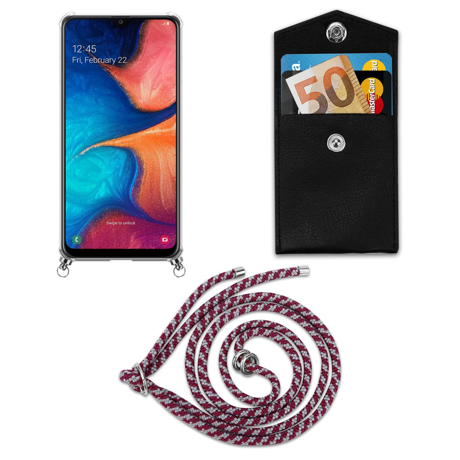 Telefono con custodia, portafoglio nero con carte e denaro e un cordino con motivo rosso e bianco.
