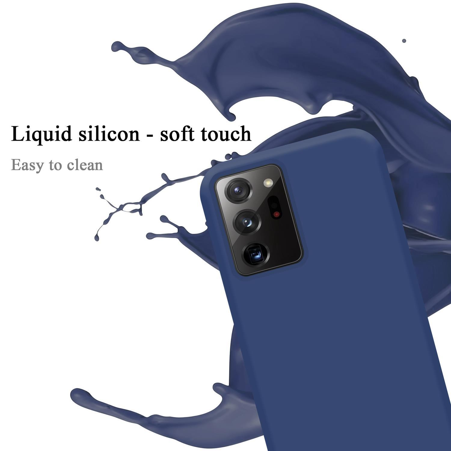 Custodia per telefono blu con uno schizzo blu scuro. Testo: Silicone liquido - tocco morbido.