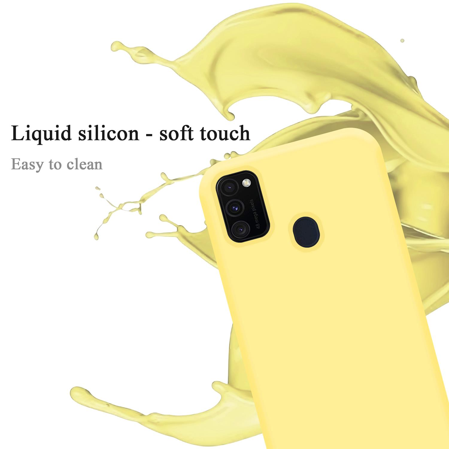 Gelbe Handyhülle mit einem Telefon. Text lautet: Flüssiges Silikon - Soft-Touch. Leicht zu reinigen. Gelber Hintergrund.