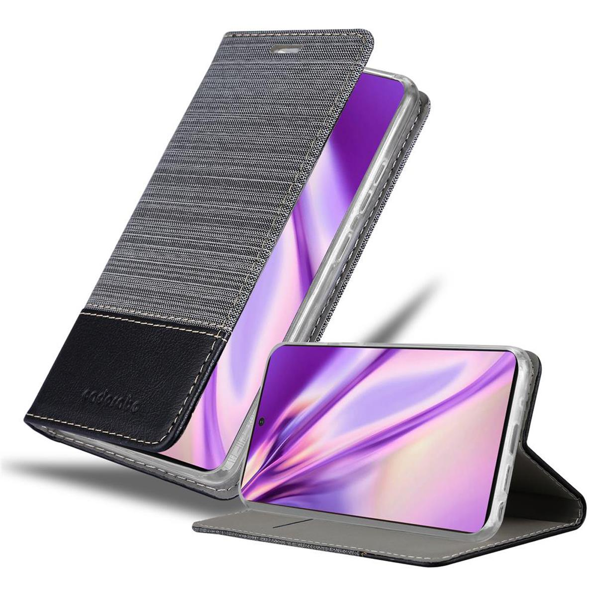 Una custodia per telefono nera e grigia con un design strutturato, aperta e con lo schermo del telefono.