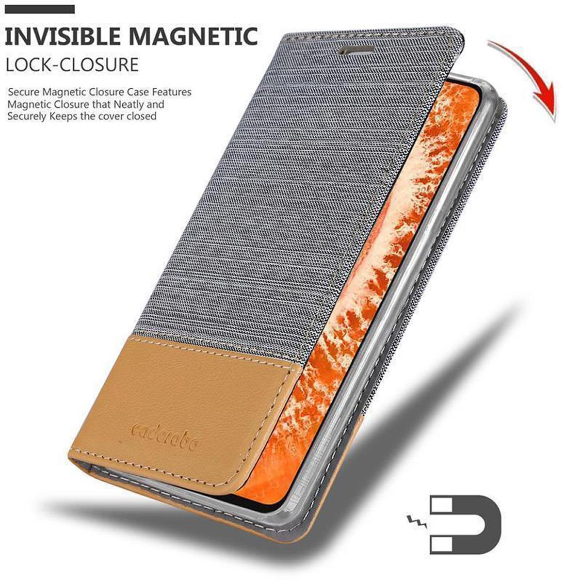 Custodia per telefono con telefono visibile. Chiusura magnetica. La custodia è marrone e blu.