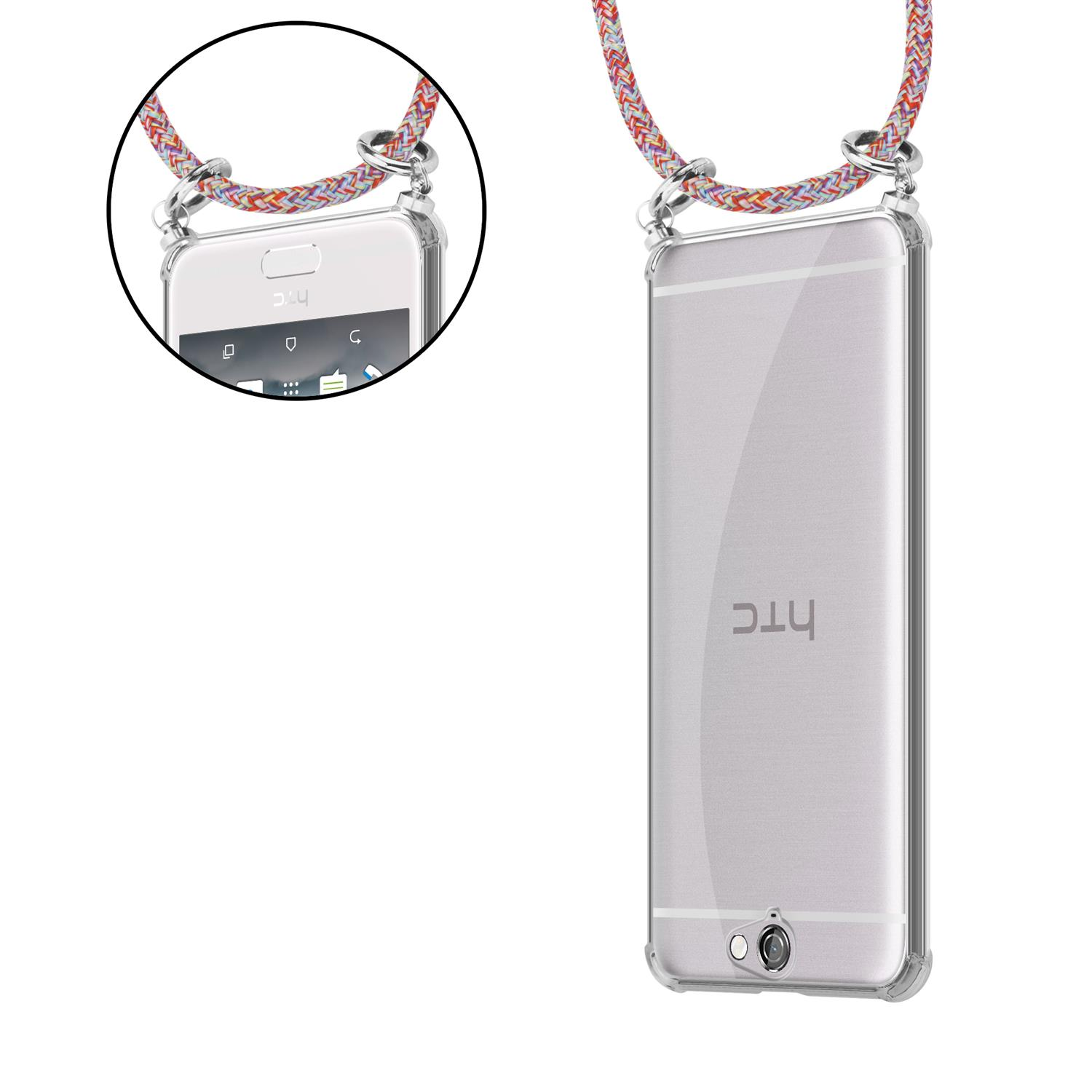 Telefon mit Riemen in einer transparenten Hülle, Rückseite zeigend. Der Riemen hat mehrere Farben. Das Telefon ist rechts.