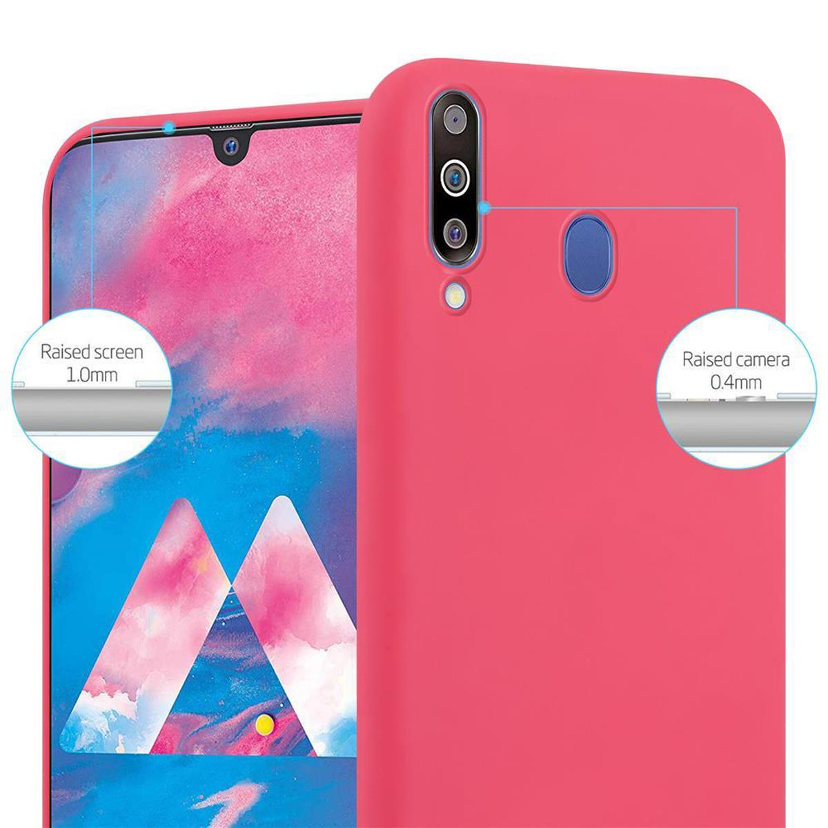Telefono rosa con bordi dello schermo e della fotocamera rialzati. Il testo indica l'altezza.