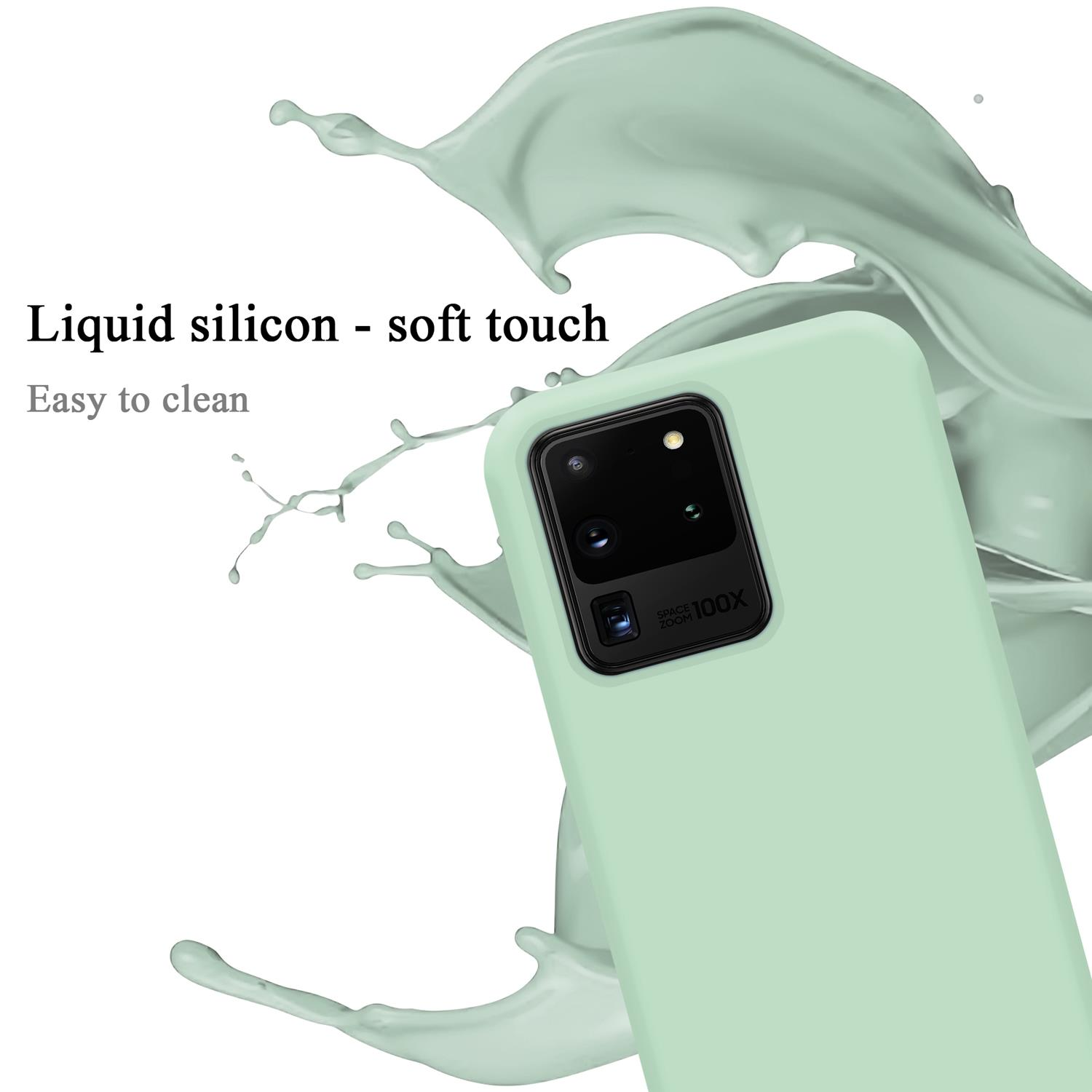 Eine mintgrüne Handyhülle mit Telefon. Weißer Hintergrund mit Flüssigkeitsspritzer.