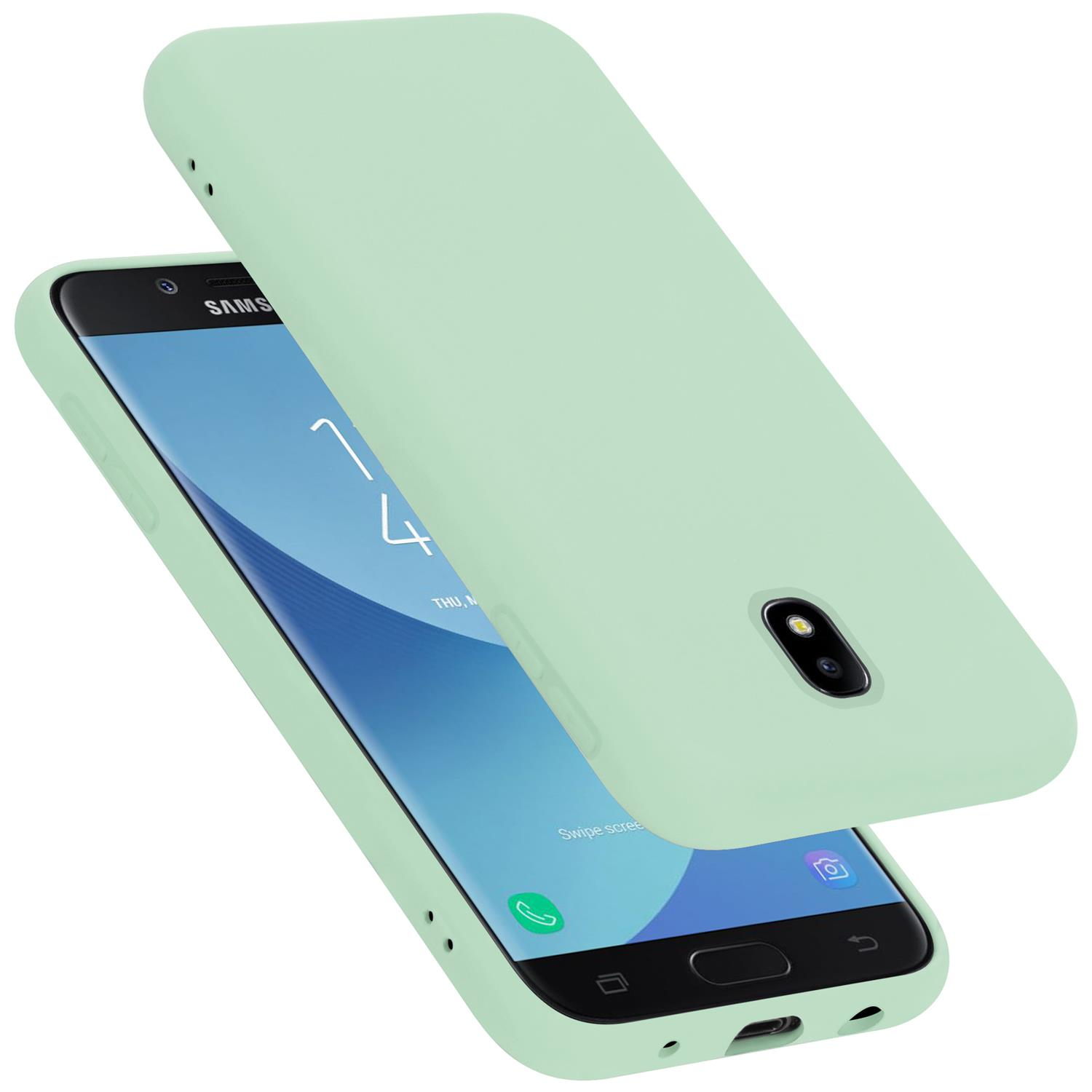 Telefono e custodia verde menta, una custodia aperta, sfondo bianco.