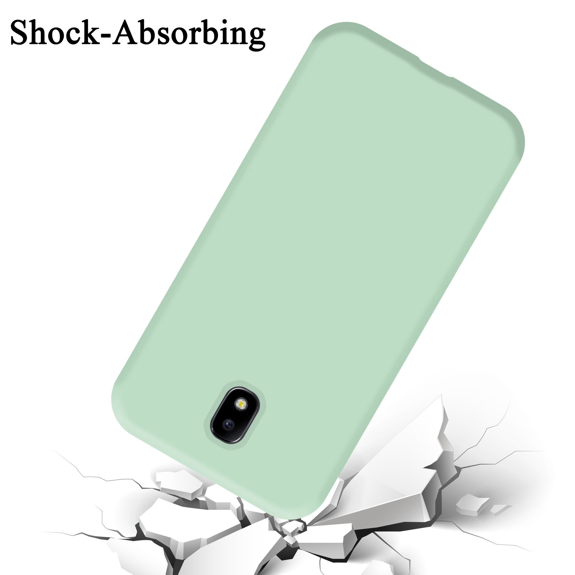 Una custodia per telefono verde menta è angolata su una superficie bianca con crepe come se fosse caduta.
