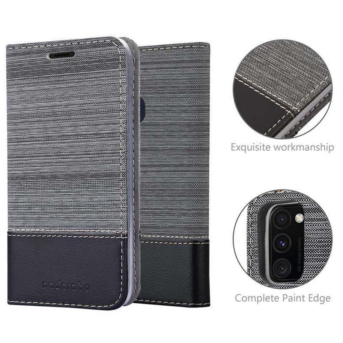 Eine geschlossene Handyhülle mit grauem und schwarzem Design. Die Hülle hat ein Telefon und Details.