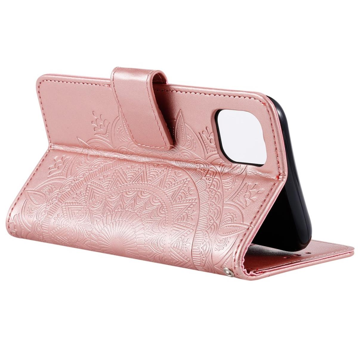Rosafarbene Handyhülle geöffnet, mit Mandala-Design und einem Telefon darin.