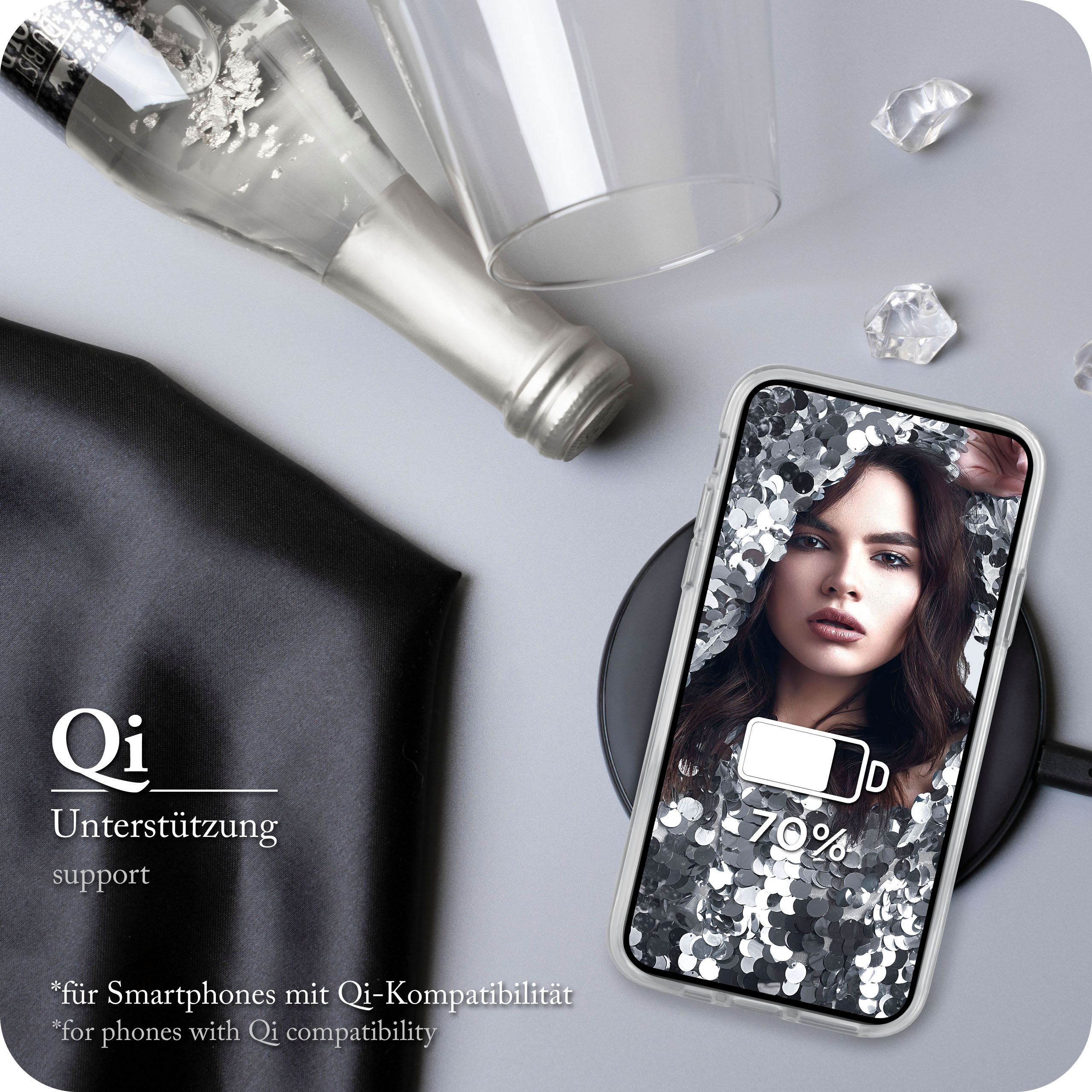 Telefon auf kabellosem Ladegerät, Champagnerflasche und Frauenbild.