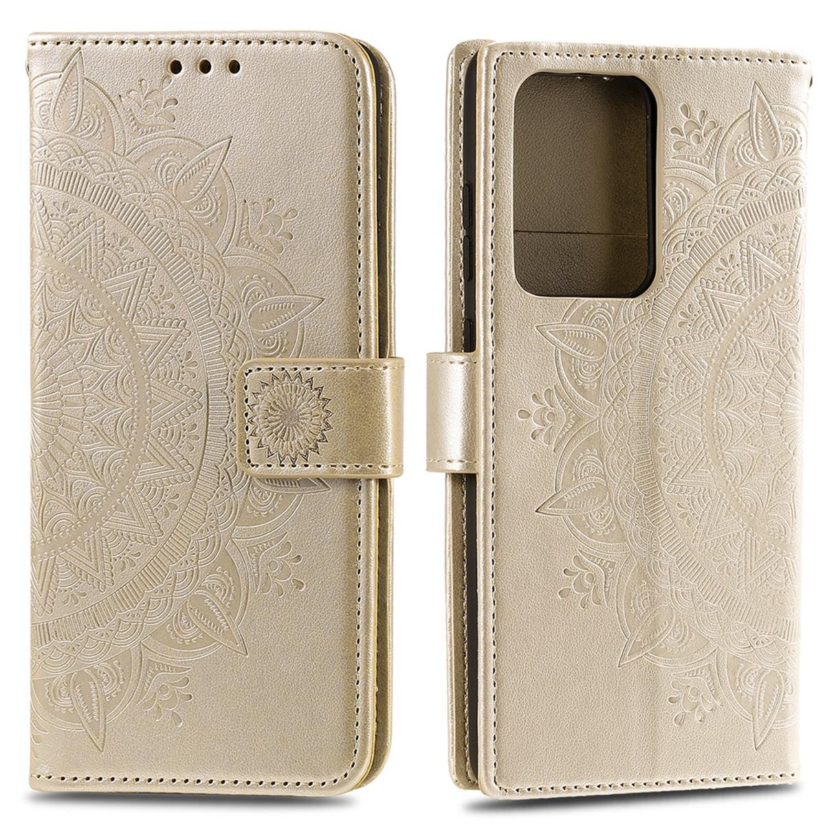 Goldene Handyhülle mit floralem Mandala-Design. Geöffnet mit Handyhalter und Klappe mit Verschluss.