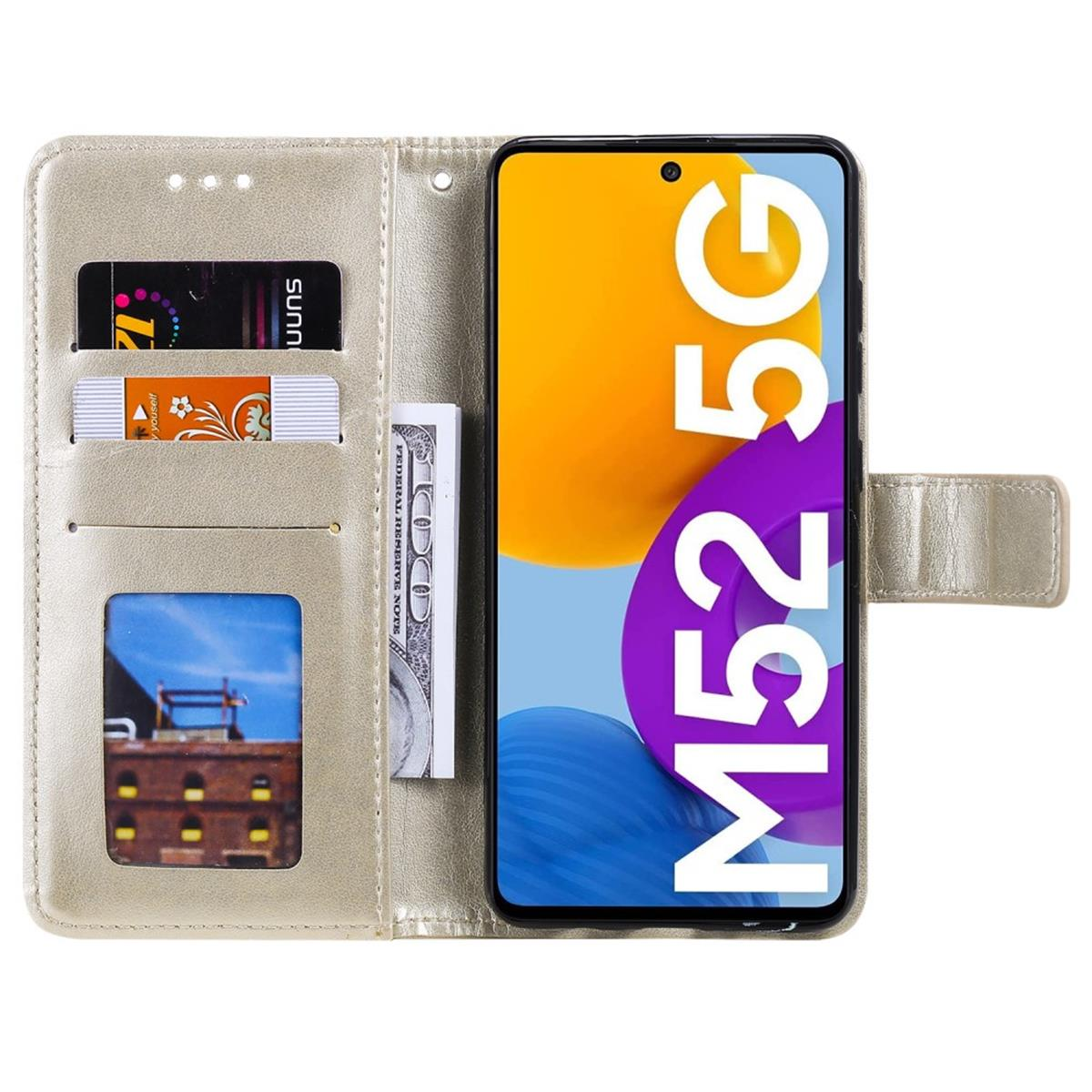 Eine goldene Handyhülle mit Telefon, Karten und Geld.