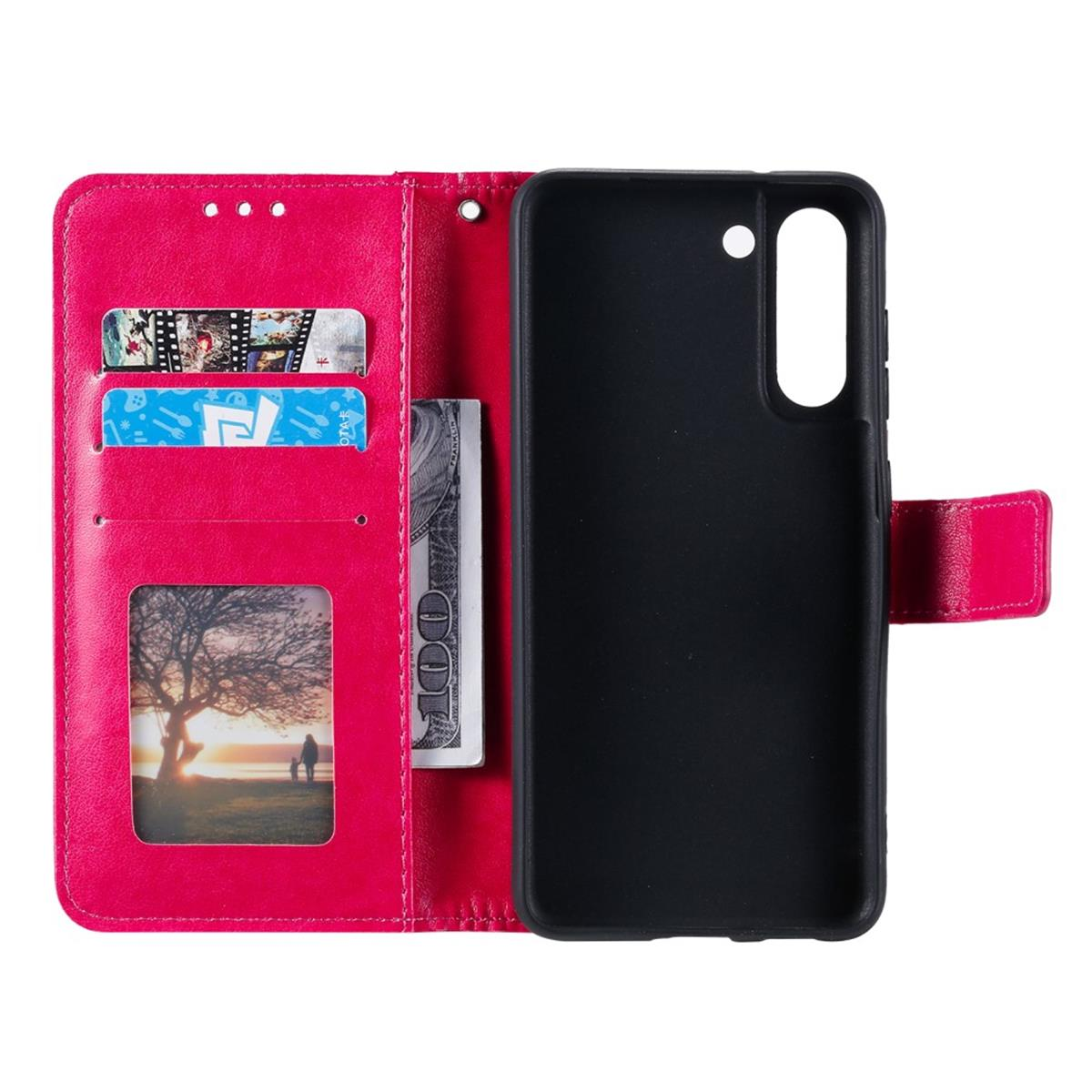 Handyhülle geöffnet. Karten und Geld innen. Telefon ist in der Hülle. Rosa Hülle. Weißer Hintergrund.