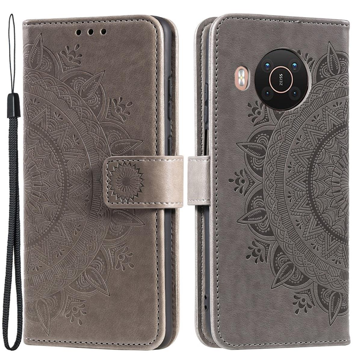 Graue Leder-Handyhülle mit Mandala-Design, offen und geschlossen.
