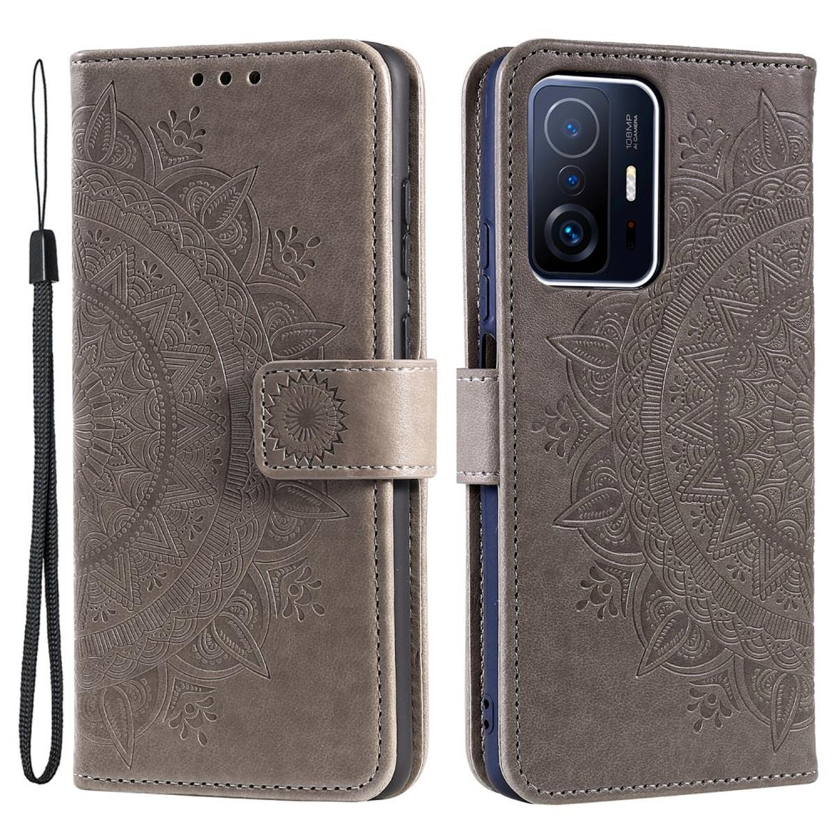 Graue Handyhülle mit Mandala-Design, Telefon sichtbar, mit passendem Handgelenkband.