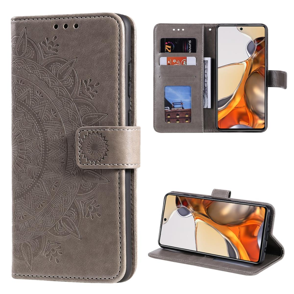 Graue Handyhülle mit Mandala-Design, geöffnet, um das Telefon und Kartenfächer zu zeigen.