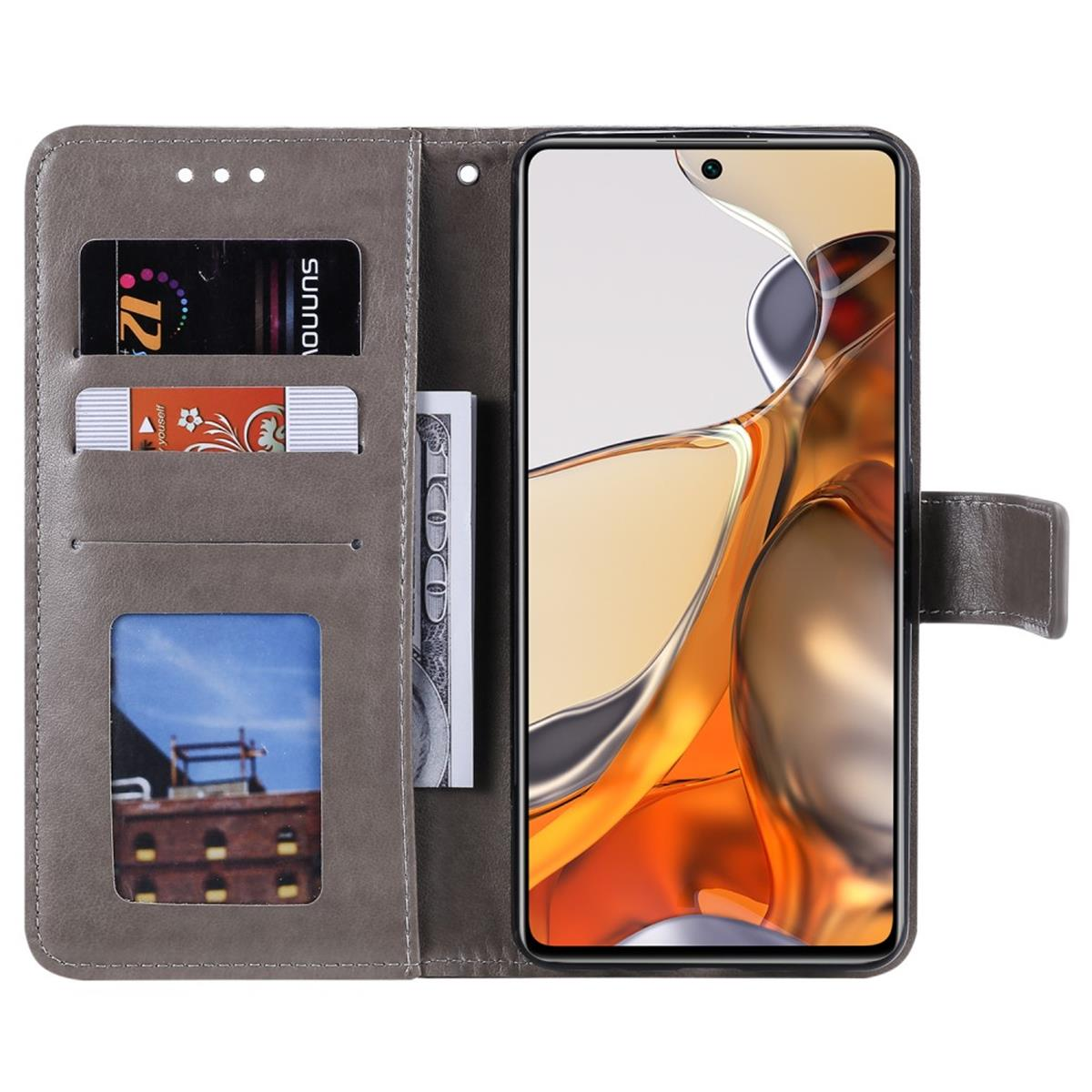 Graue Handyhülle mit Karten, Geld und Telefon. Hat einen Magnetverschluss.