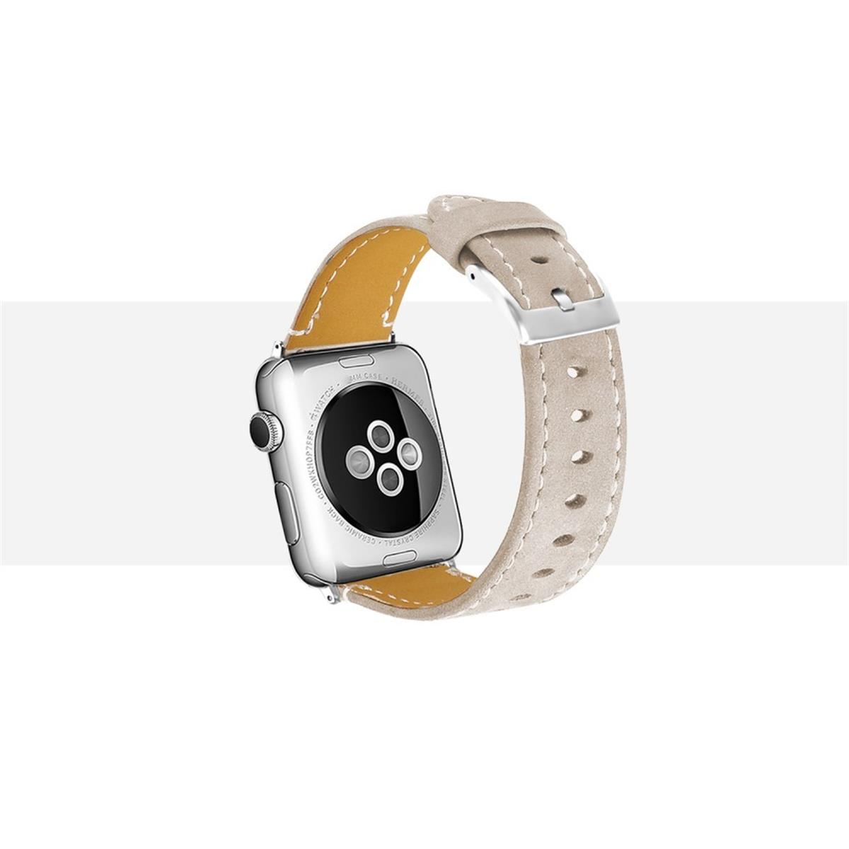 Silberne Apple Watch mit hellbraunem Lederarmband. Die Uhr liegt auf einer weißen Oberfläche.