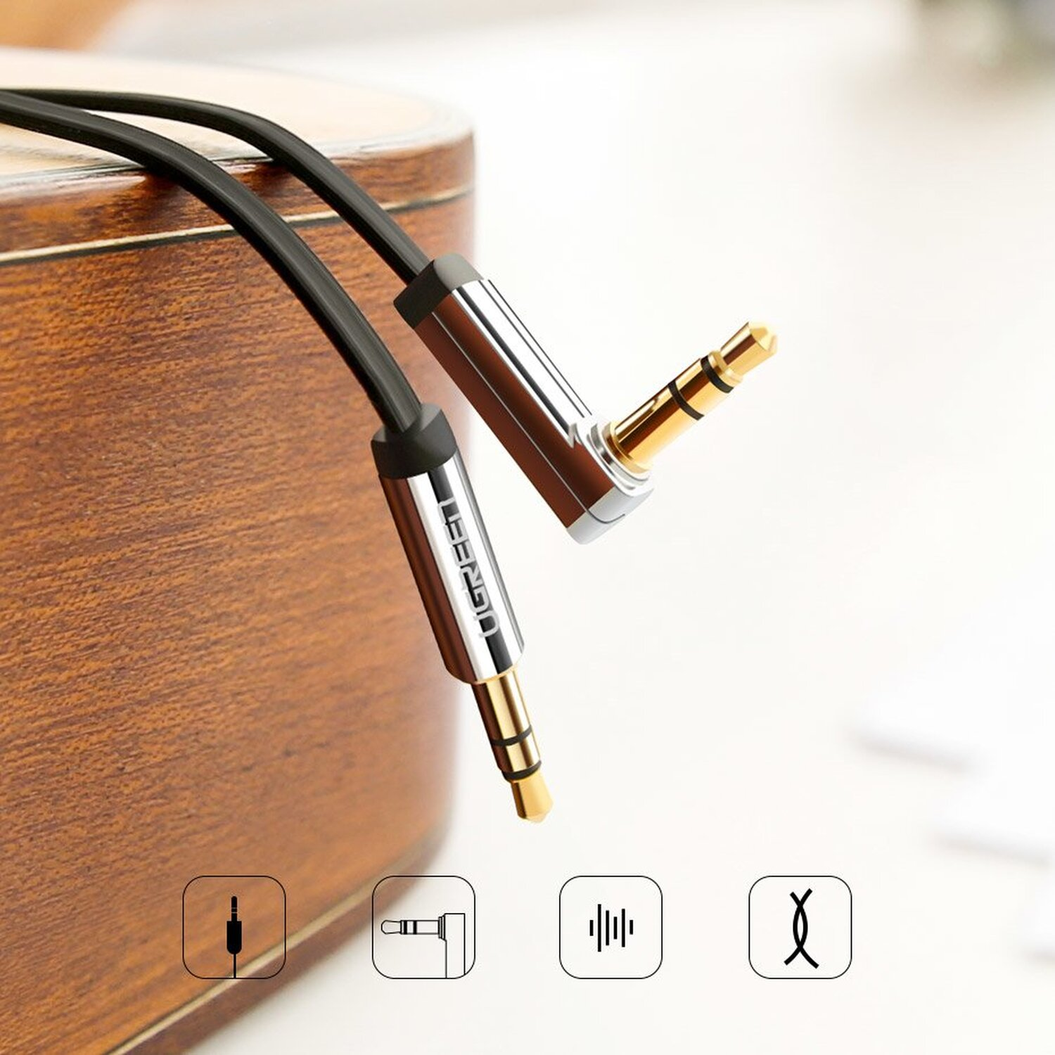 Czarne i srebrne kable audio z wtyczkami 3,5 mm i ikonami.