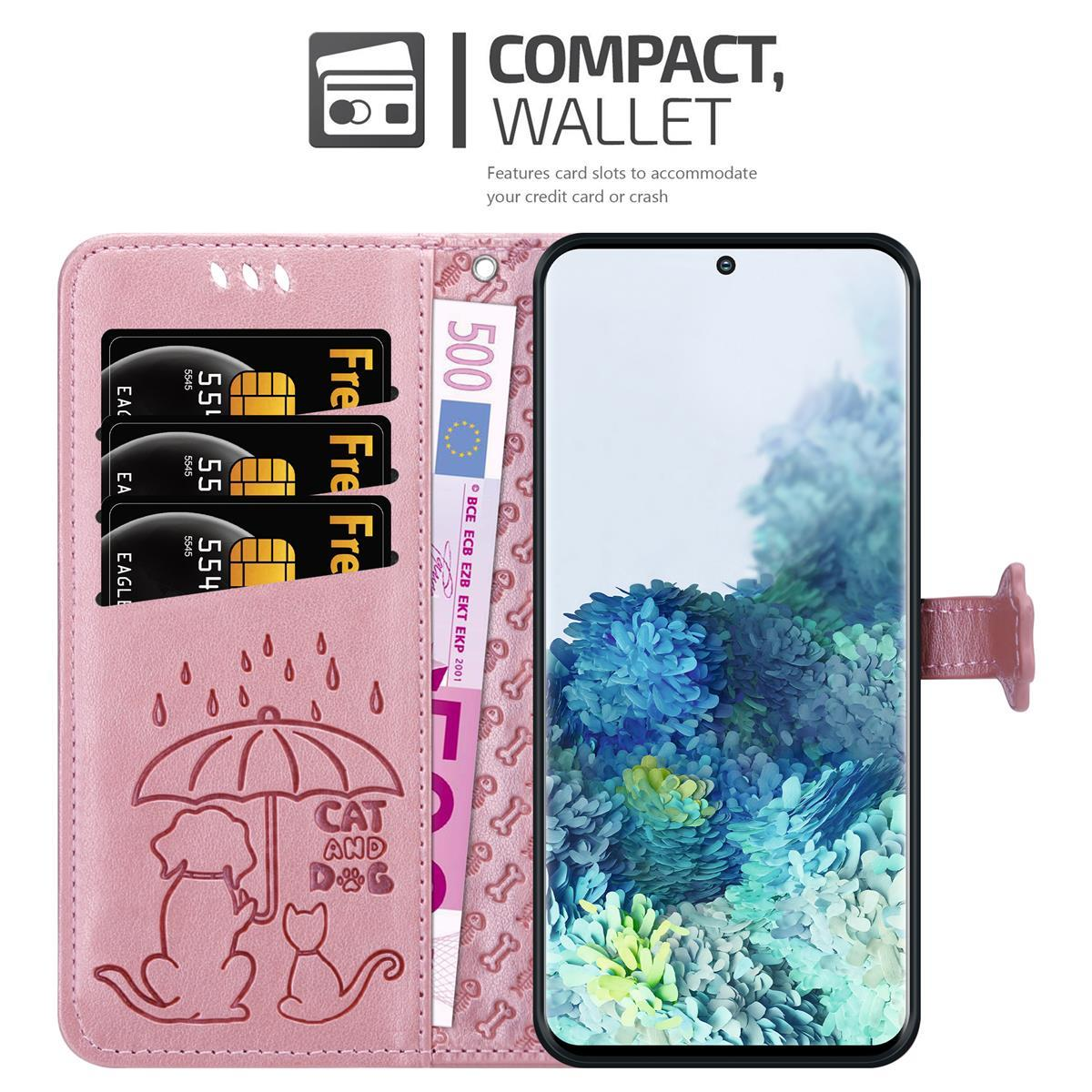 Portafoglio rosa per telefono con carte, una banconota da 500 euro e un telefono. Ci sono contorni di cani e gatti.