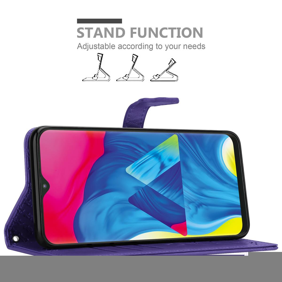 Eine Handyhülle mit einem Telefon darin und drei Ständerkonfigurationen.