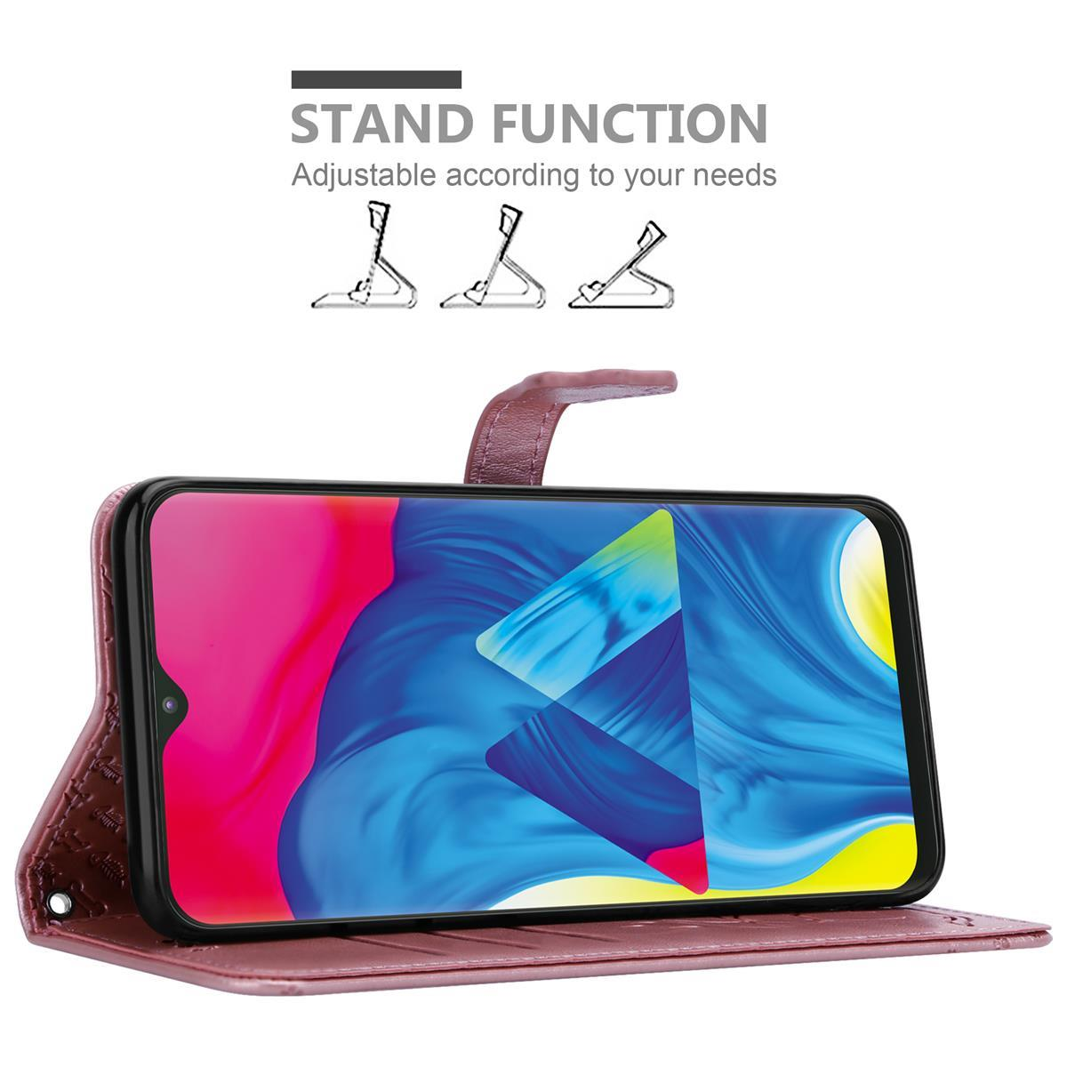 Telefonhülle in Rosa mit Telefon innen. Hülle offen, Telefonbildschirm zeigt blauen Hintergrund. Weißer Hintergrund.