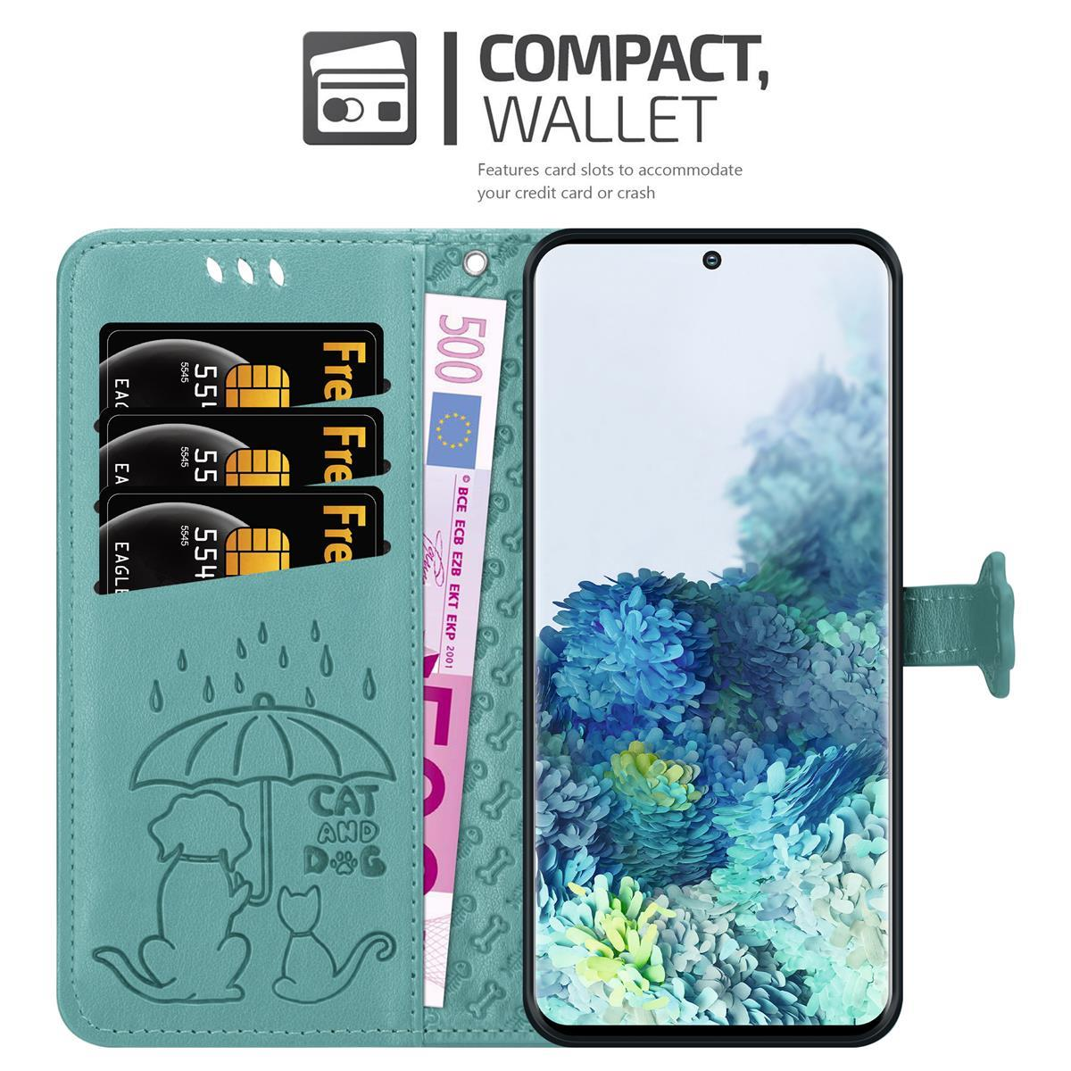 Custodia a portafoglio turchese con carte, contanti e telefono. Presenta un design cane e gatto.