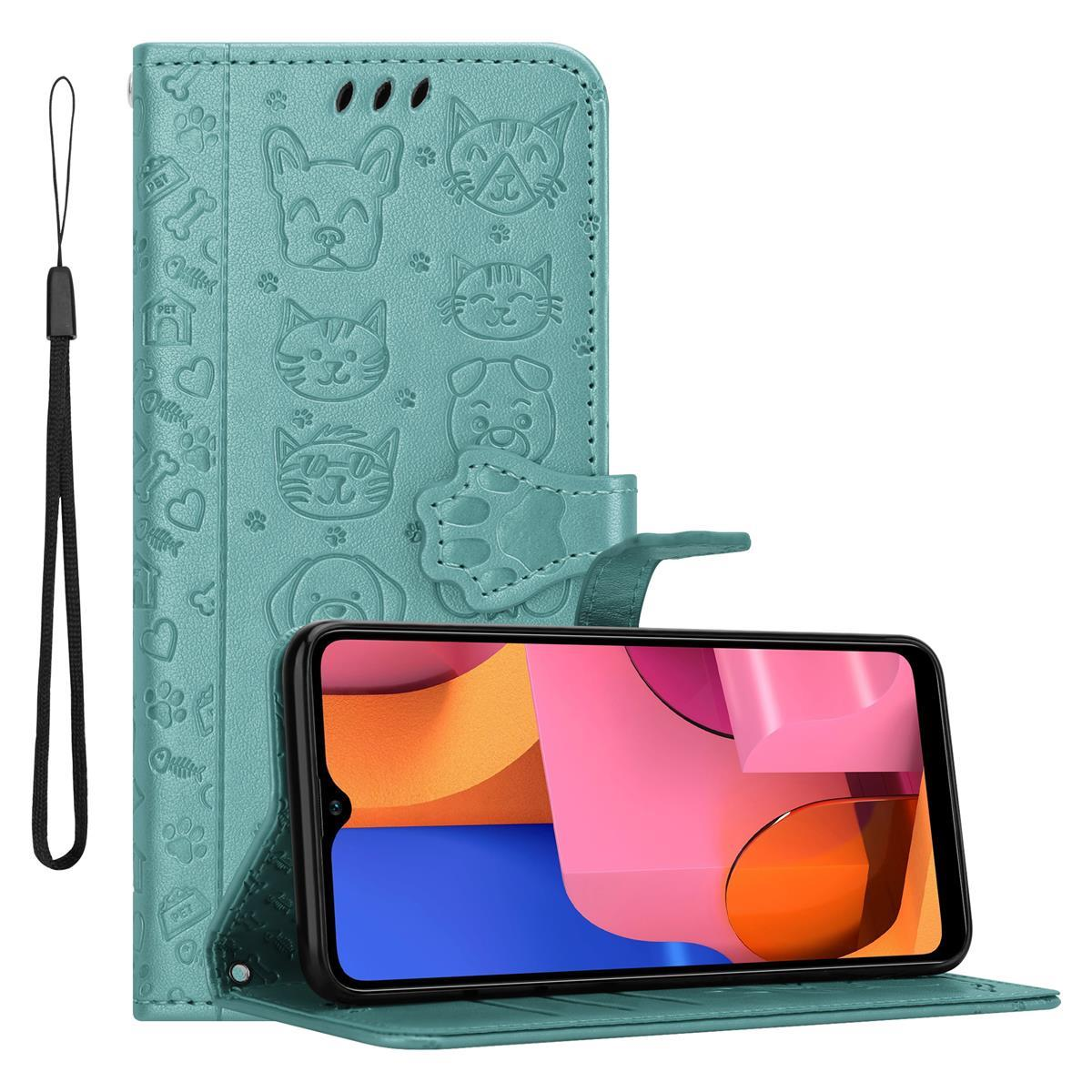 Custodia per telefono verde acqua con disegni di cani e gatti. Telefono dentro, schermo con forme rosa.