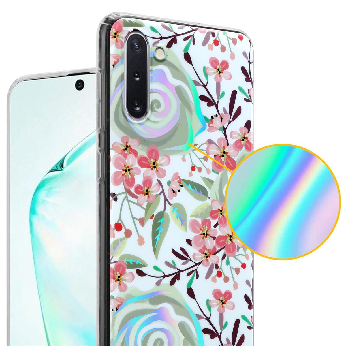 Custodia per telefono con design floreale. I fiori sono rosa e bianchi. Lo sfondo è un bokeh azzurro.