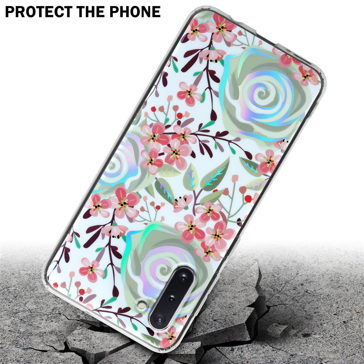 Custodia per telefono con un design floreale, appoggiata su cemento incrinato.