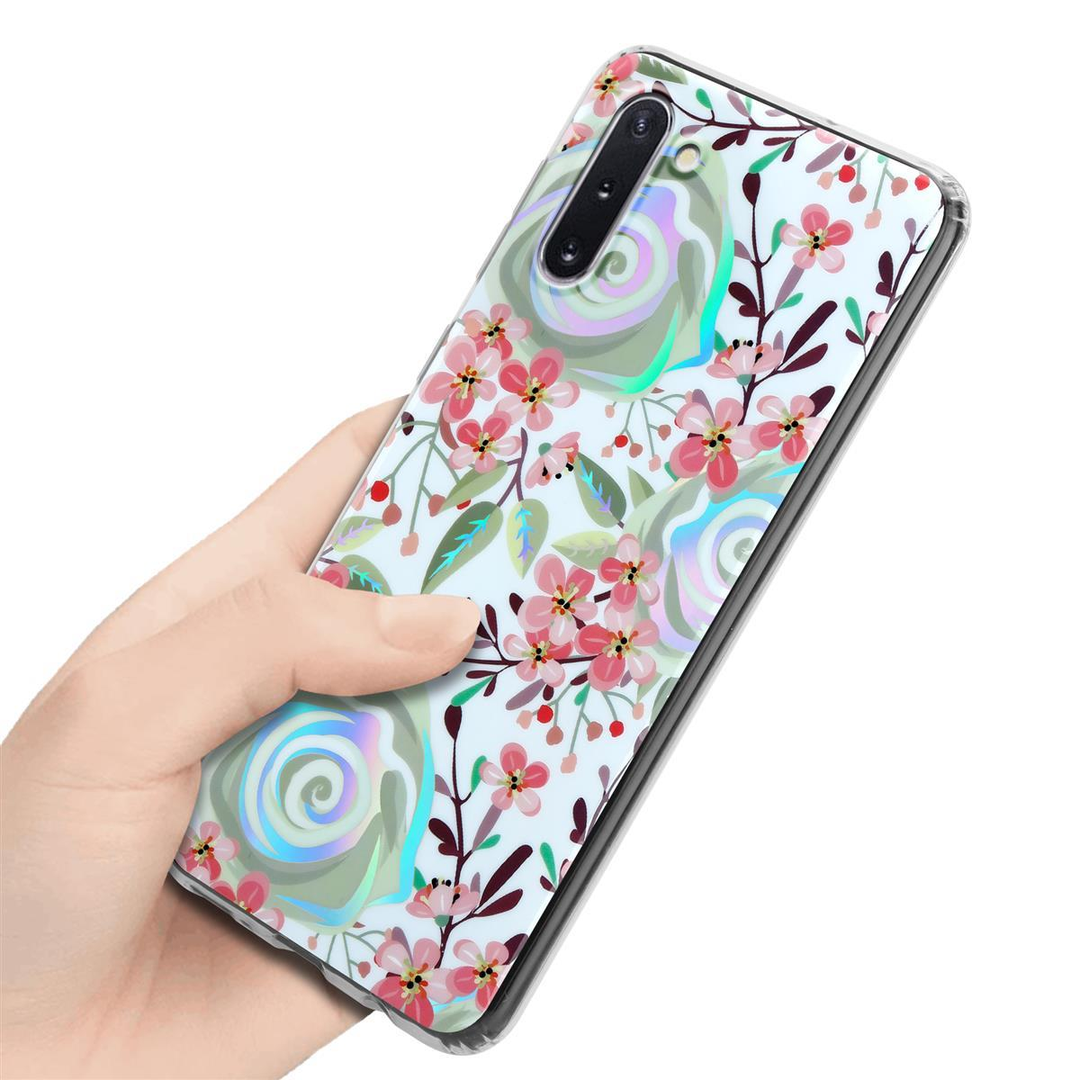 Mano che tiene una custodia per telefono con un design floreale. Fiori rosa e foglie verdi visibili.
