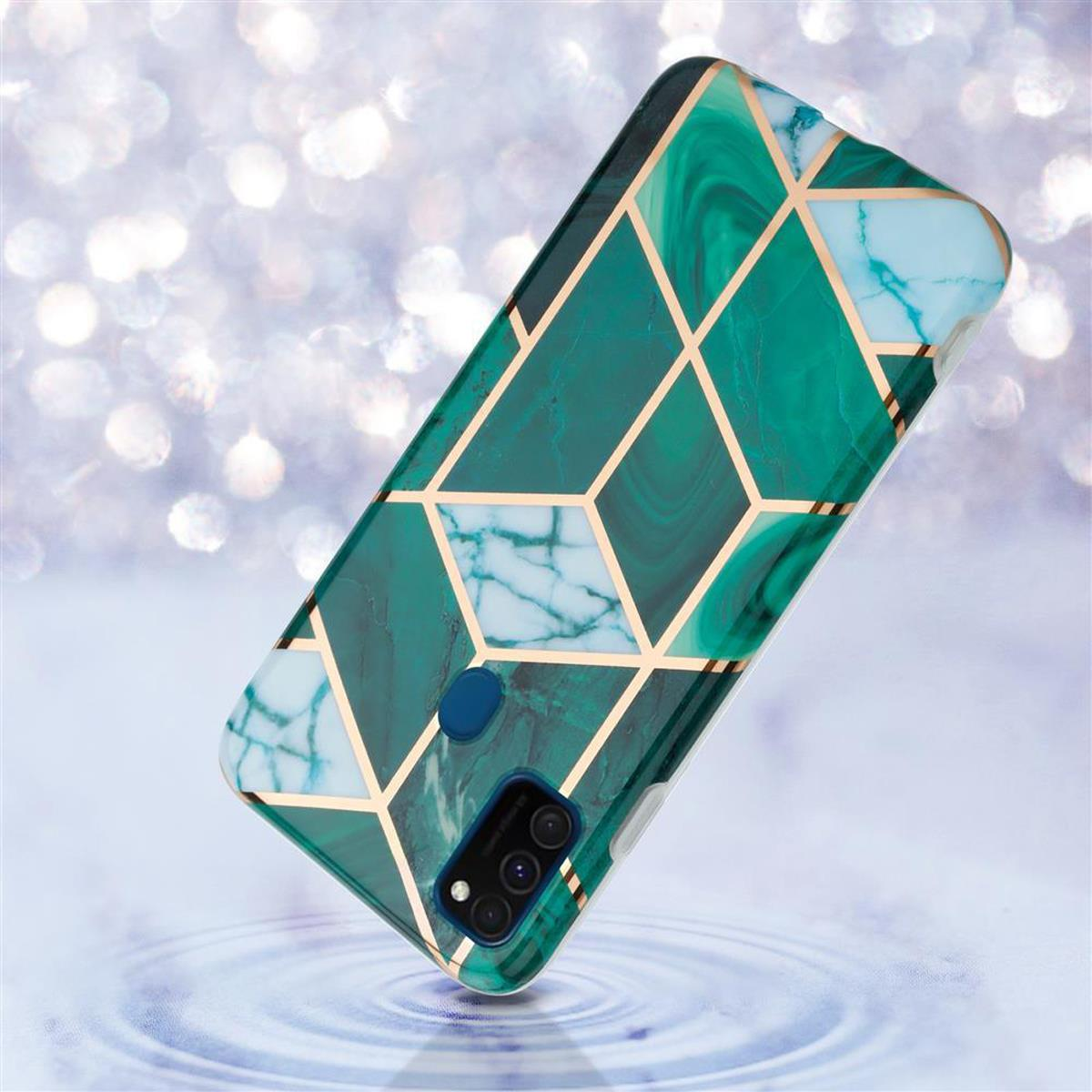 Una custodia per telefono con un design in marmo verde e linee dorate, leggermente angolata su uno sfondo sfocato.