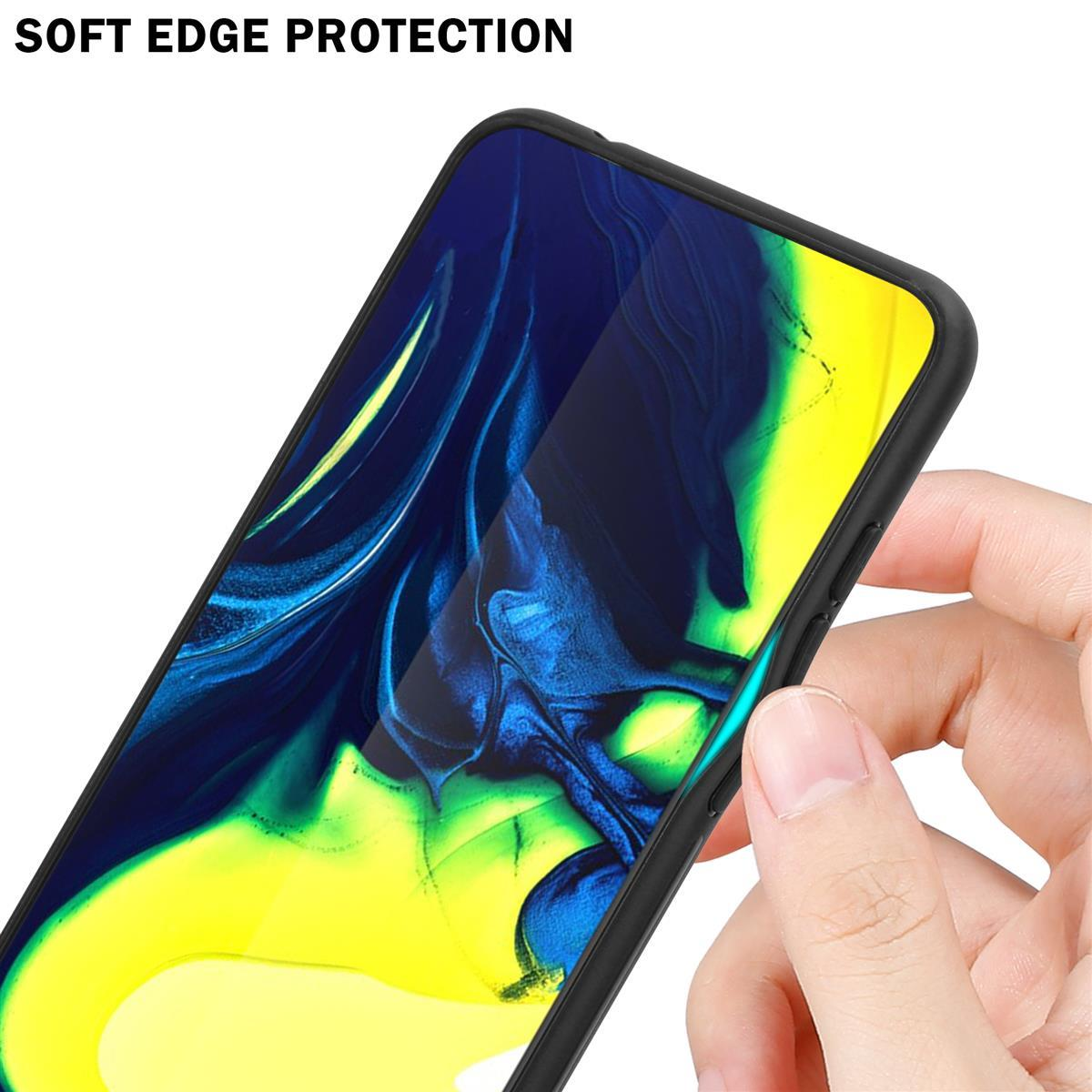 Mano che tiene un telefono con custodia nera. Schermo mostra design colorato. Testo: PROTEZIONE BORDI MORBIDA.