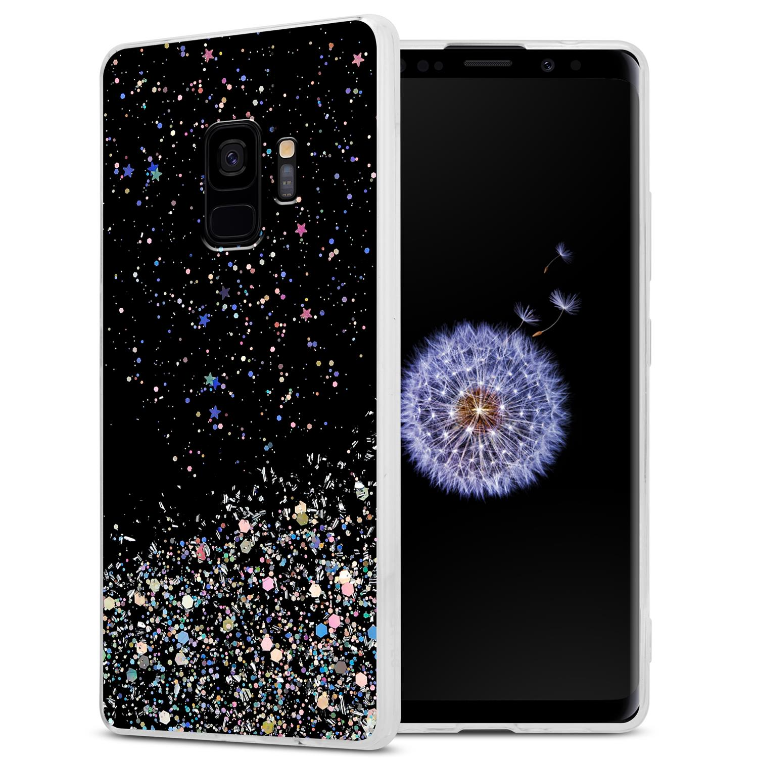 Schwarze Handyhülle und Telefon mit Glitzerdesign. Weißer Hintergrund.