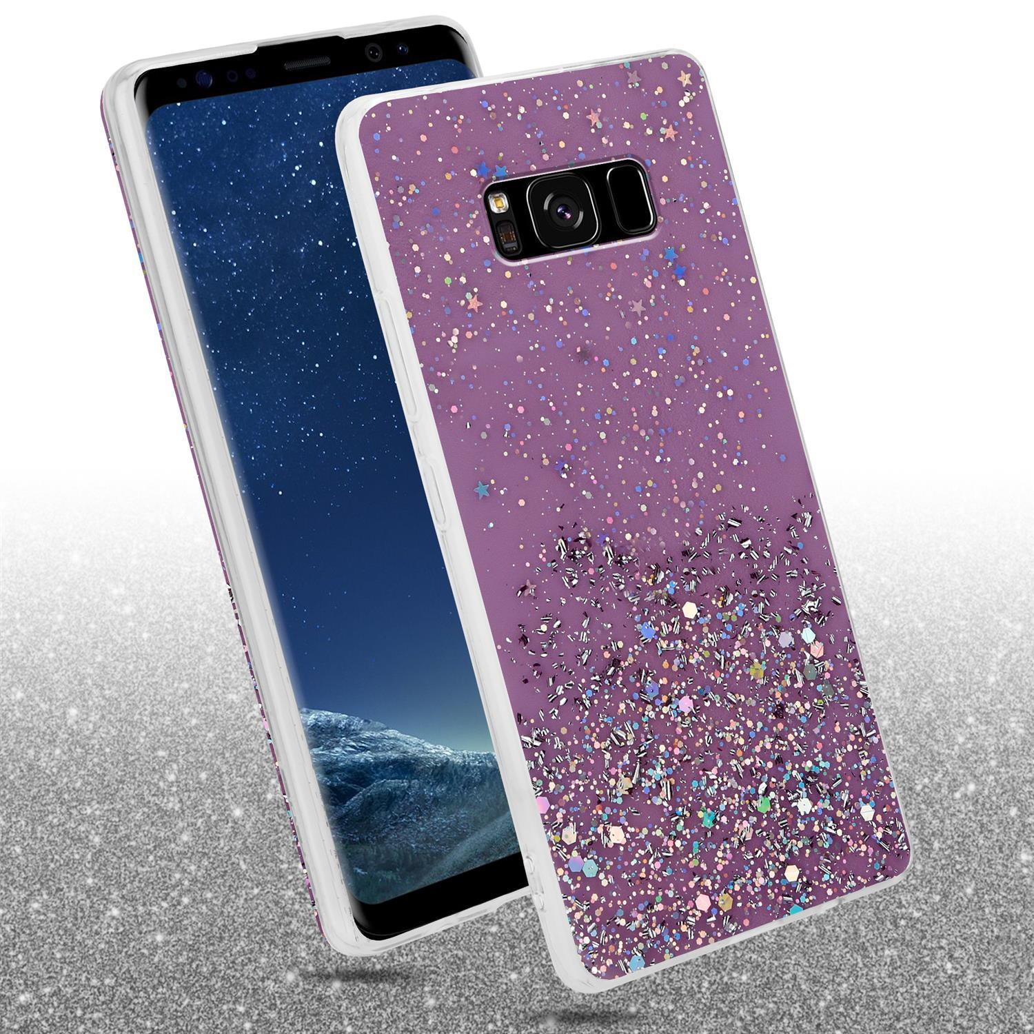 Eine Handyhülle mit einem lila Glitzerdesign. Das Telefon liegt auf einer glänzenden Oberfläche.
