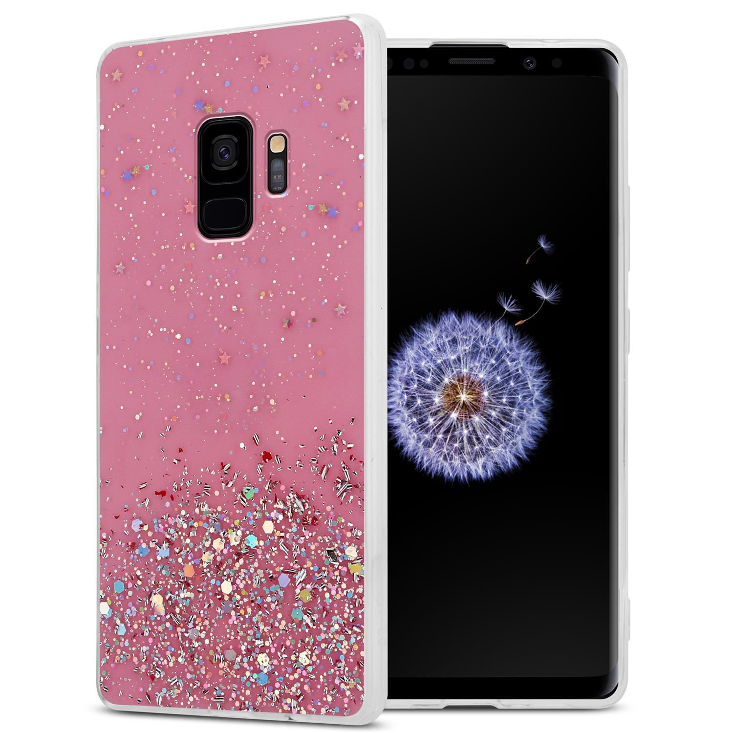 Rosa Glitzer-Handyhülle auf einem Telefon mit weißem Rahmen.