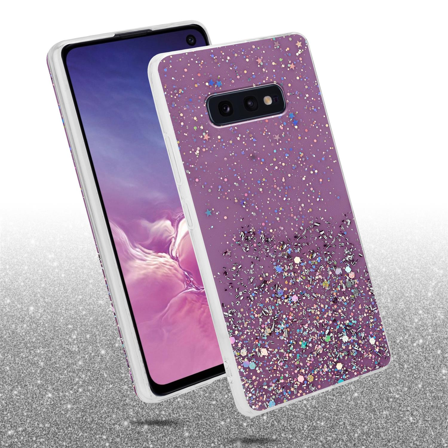 Handyhülle mit Glitzerdesign auf lila Hintergrund, ein Telefon ist darin. Beide liegen auf glitzernder Oberfläche.