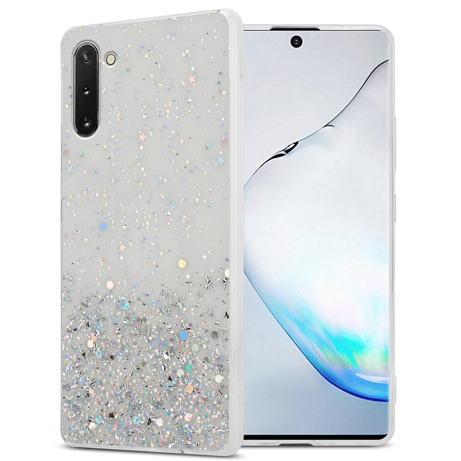 Uno smartphone in una custodia glitterata, con custodia a sinistra e schermo del telefono a destra.