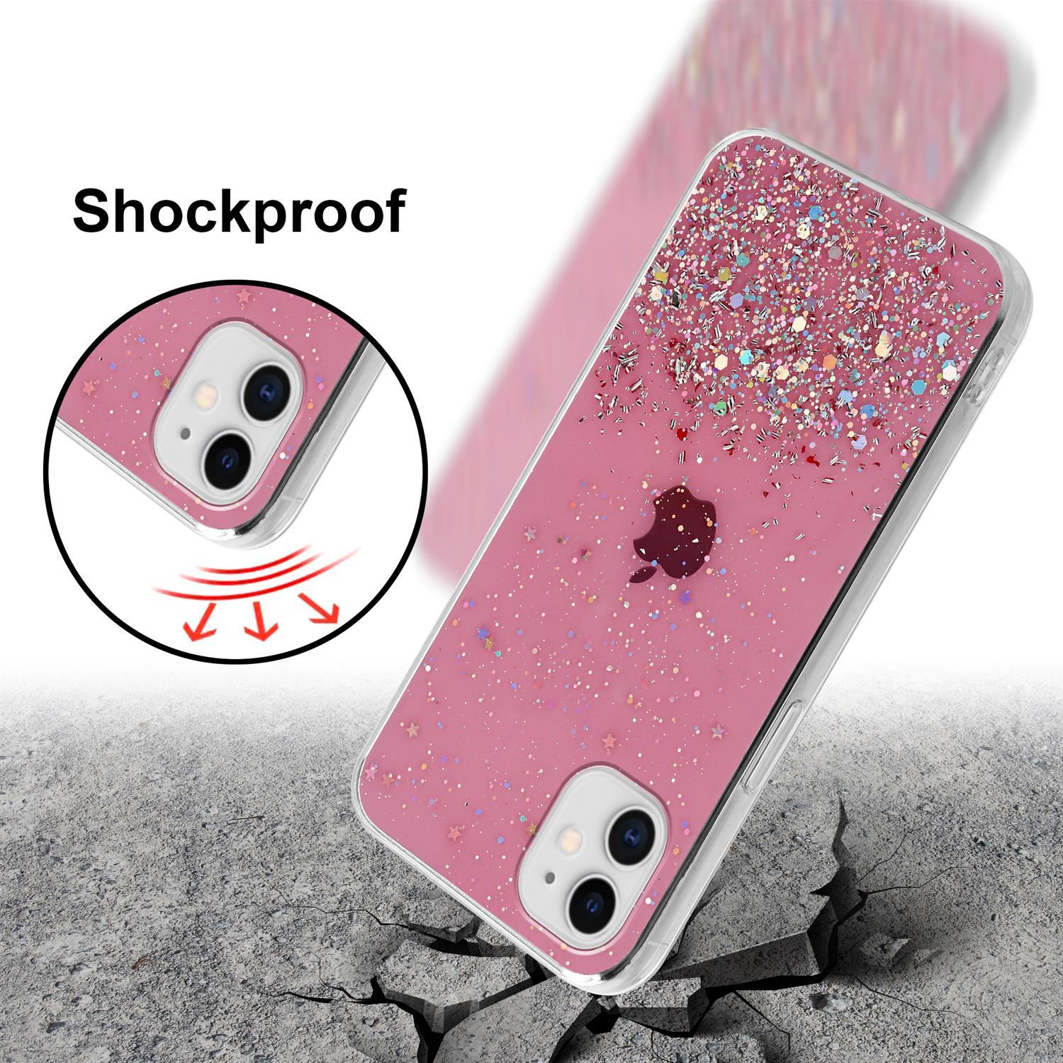 Pinke Handyhülle mit Glitzereffekt. Stoßfest, auf rissigem Boden gezeigt.